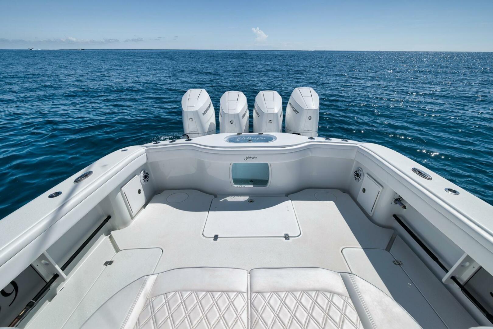 2023 Yellowfin 39 Offshore boat with quad engines on open sea.