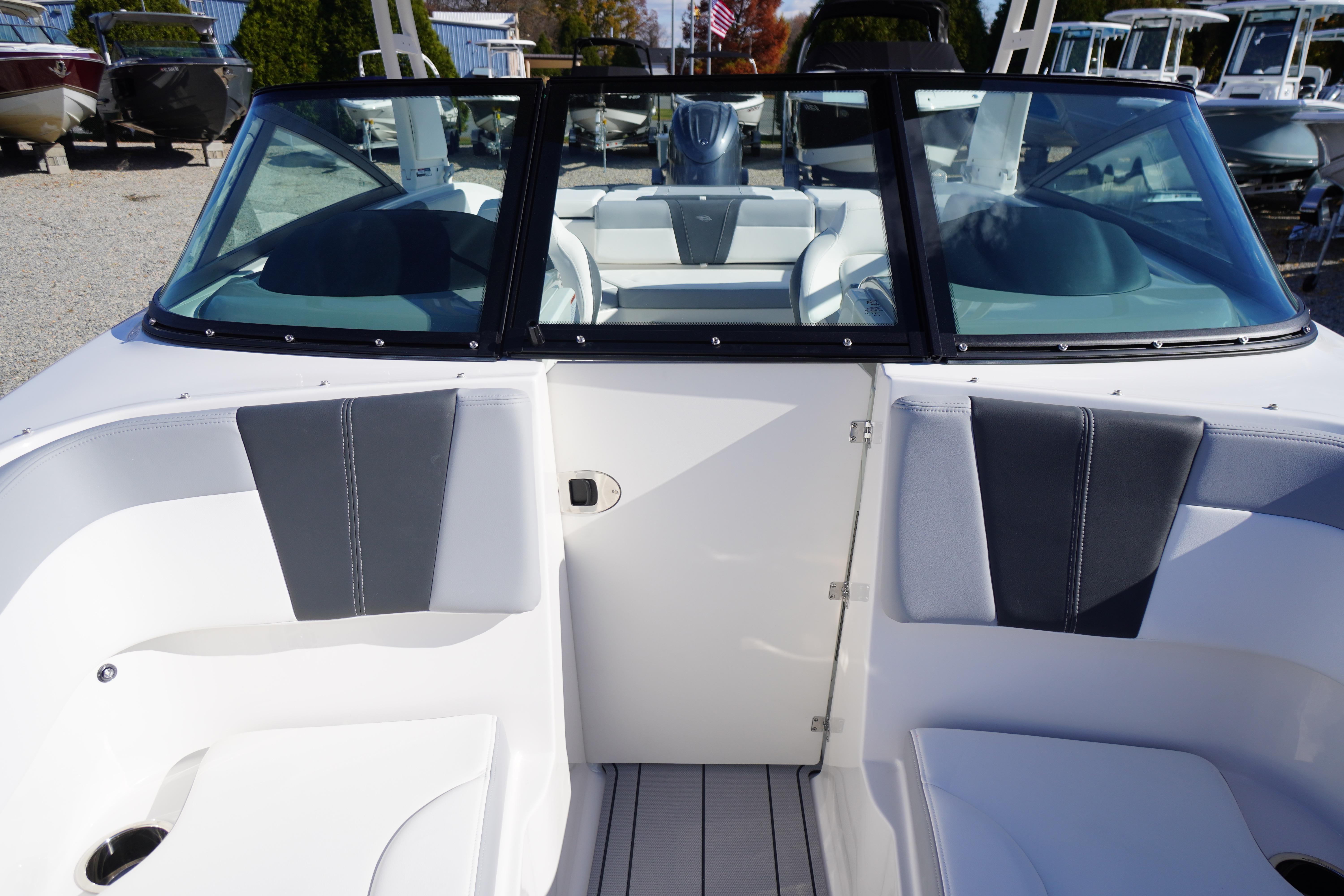 2026 Chaparral 23 SSi OB boat interior with sleek seating and windshield design.