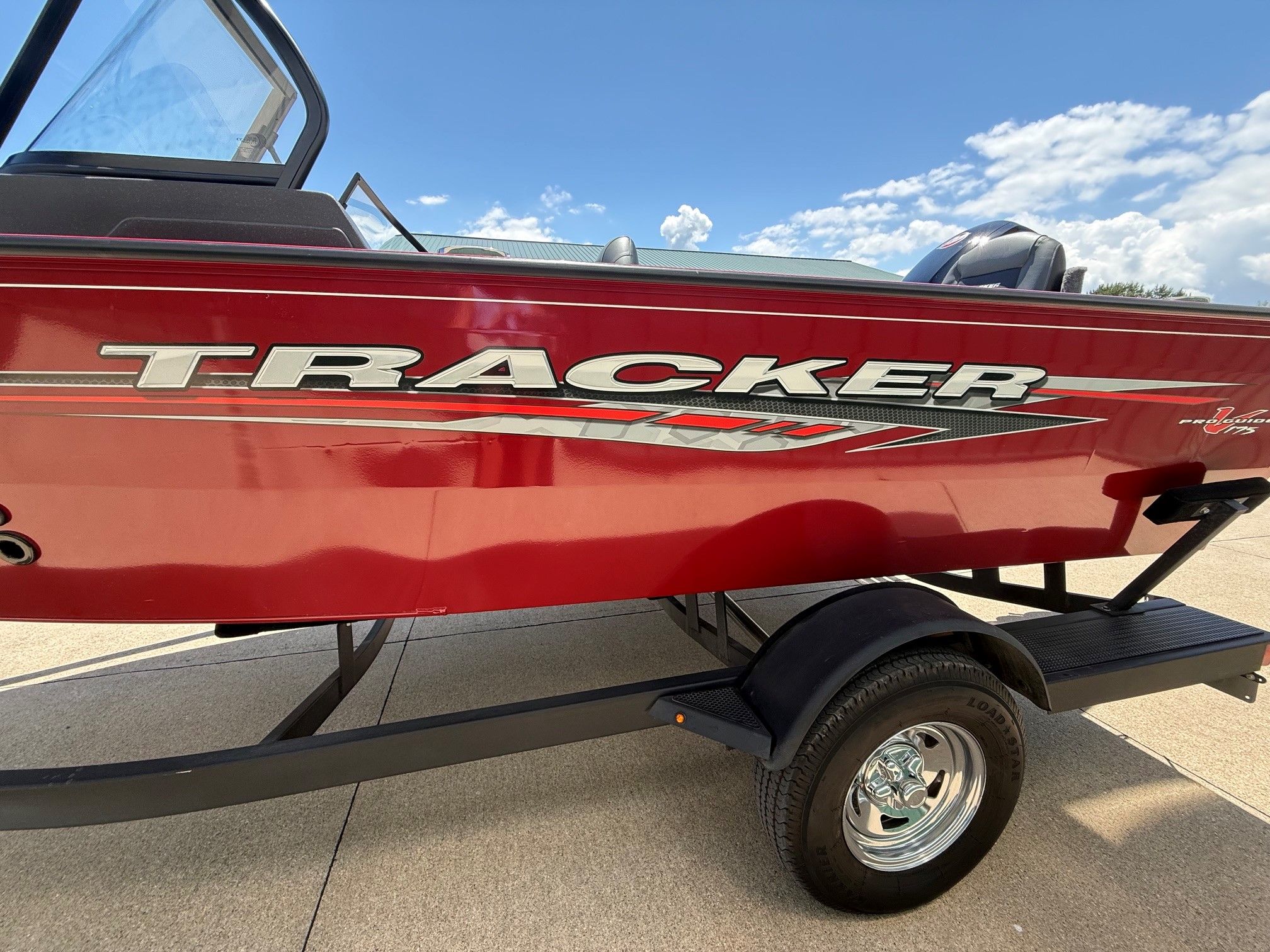 Red 2024 Tracker Pro Guide V175 boat on a trailer.