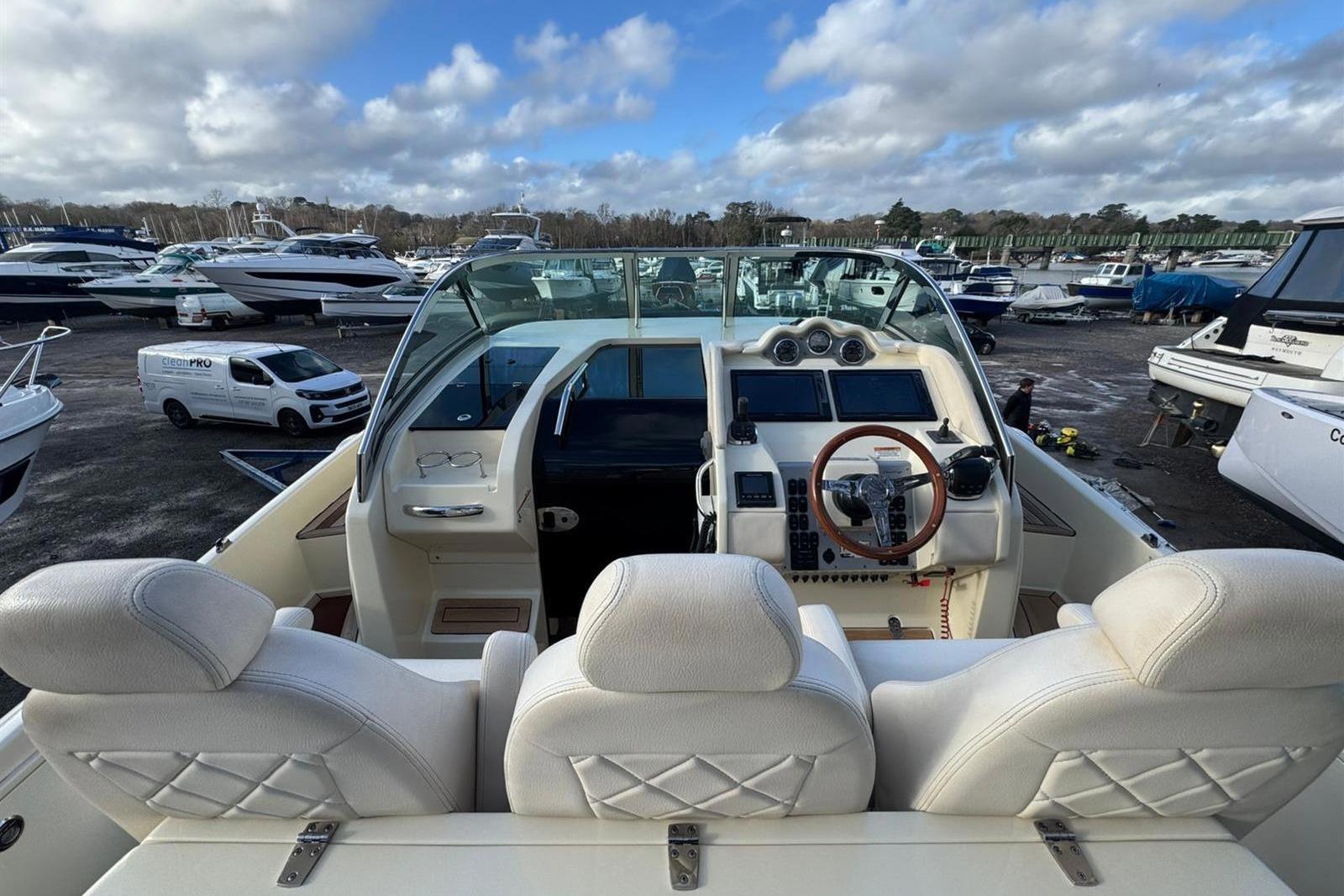 2017 Chris-Craft Launch 36 boat interior with luxurious seating and modern dashboard.