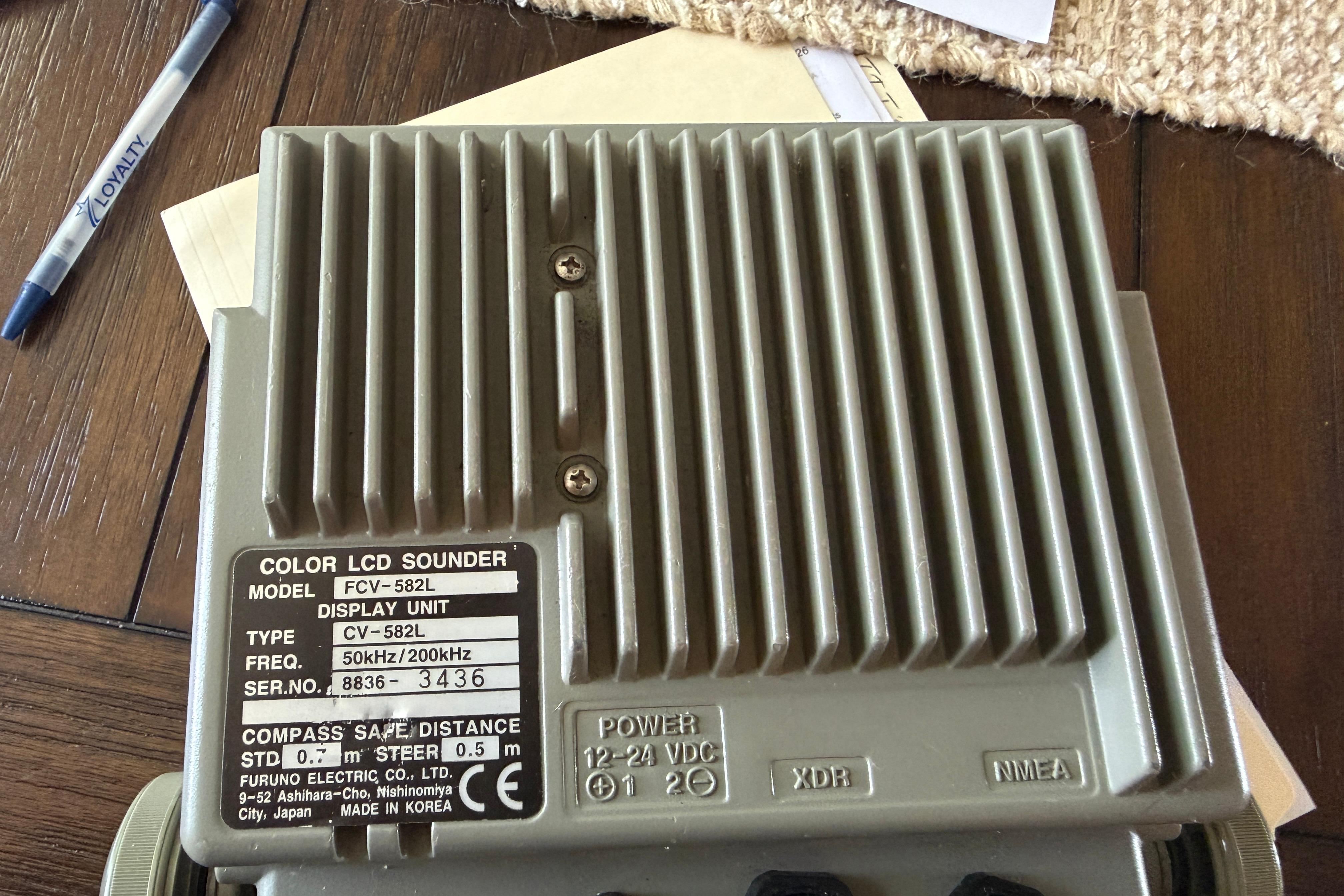 Color LCD sounder FCV-582L display unit on wooden table, Grady-White Seafarer 22, 1987.