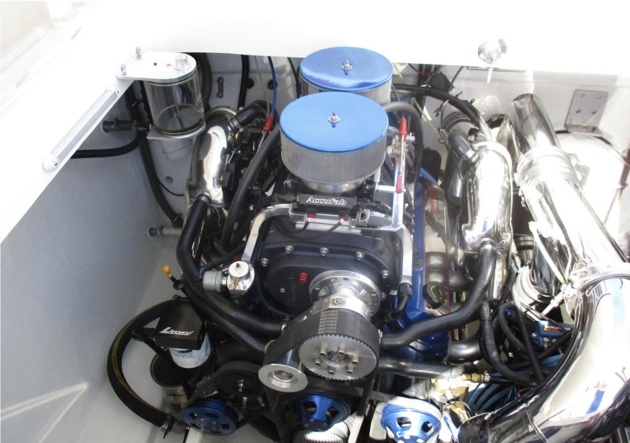 2003 Fountain 38 Lightning engine compartment with dual air filters and chrome components.