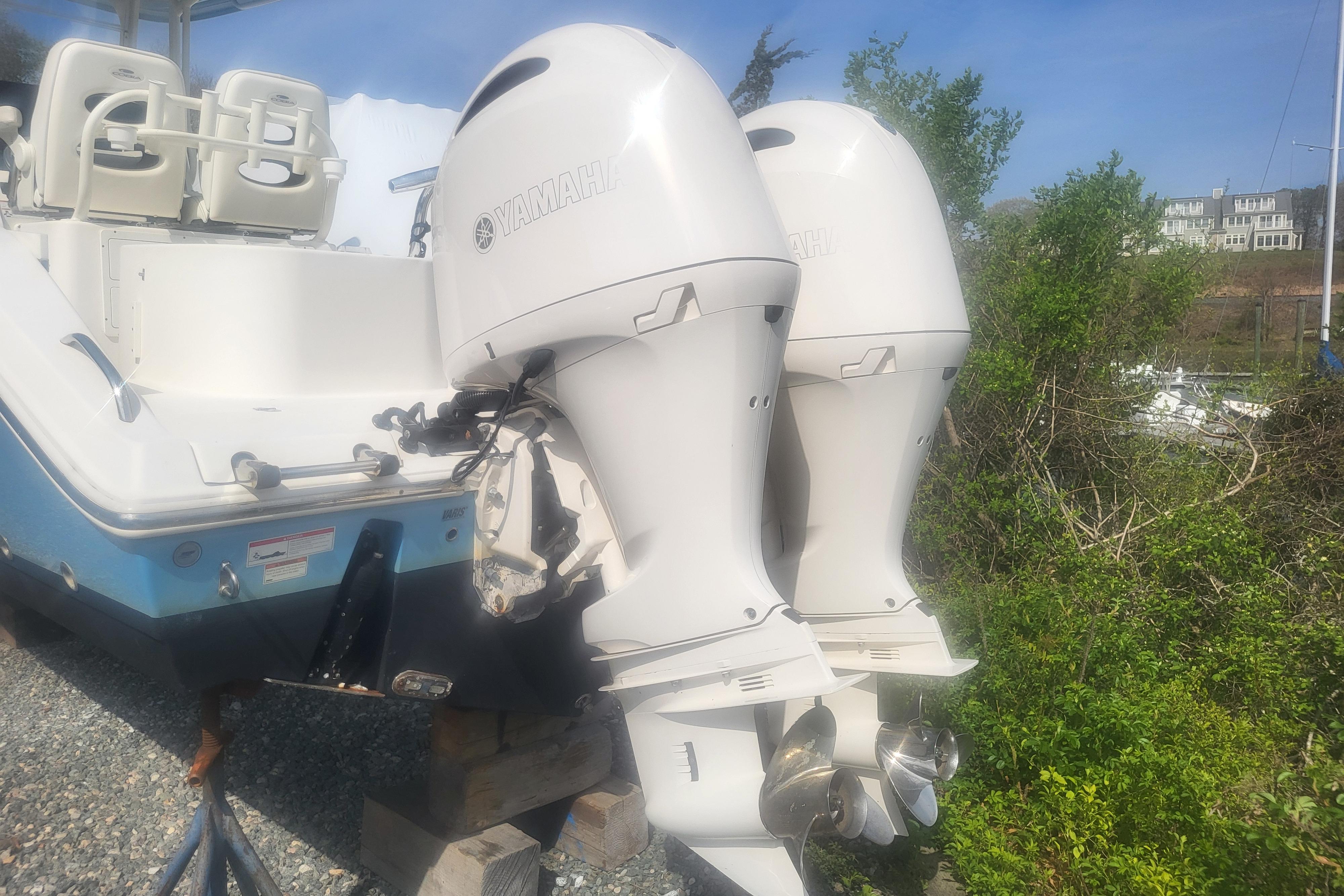 2022 Cobia 262 Center Console boat with twin Yamaha outboard engines.