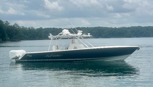 2008 SeaVee 390B boat on calm water under cloudy sky.