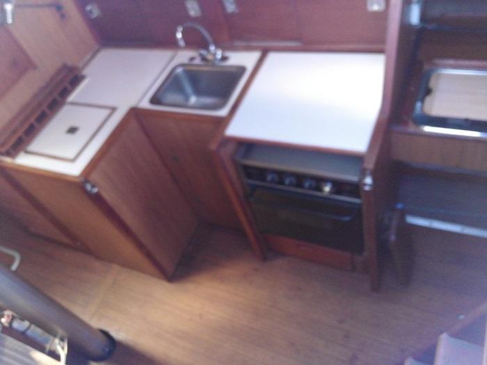 1973 Allied Mistress yacht kitchen area with sink and stove.