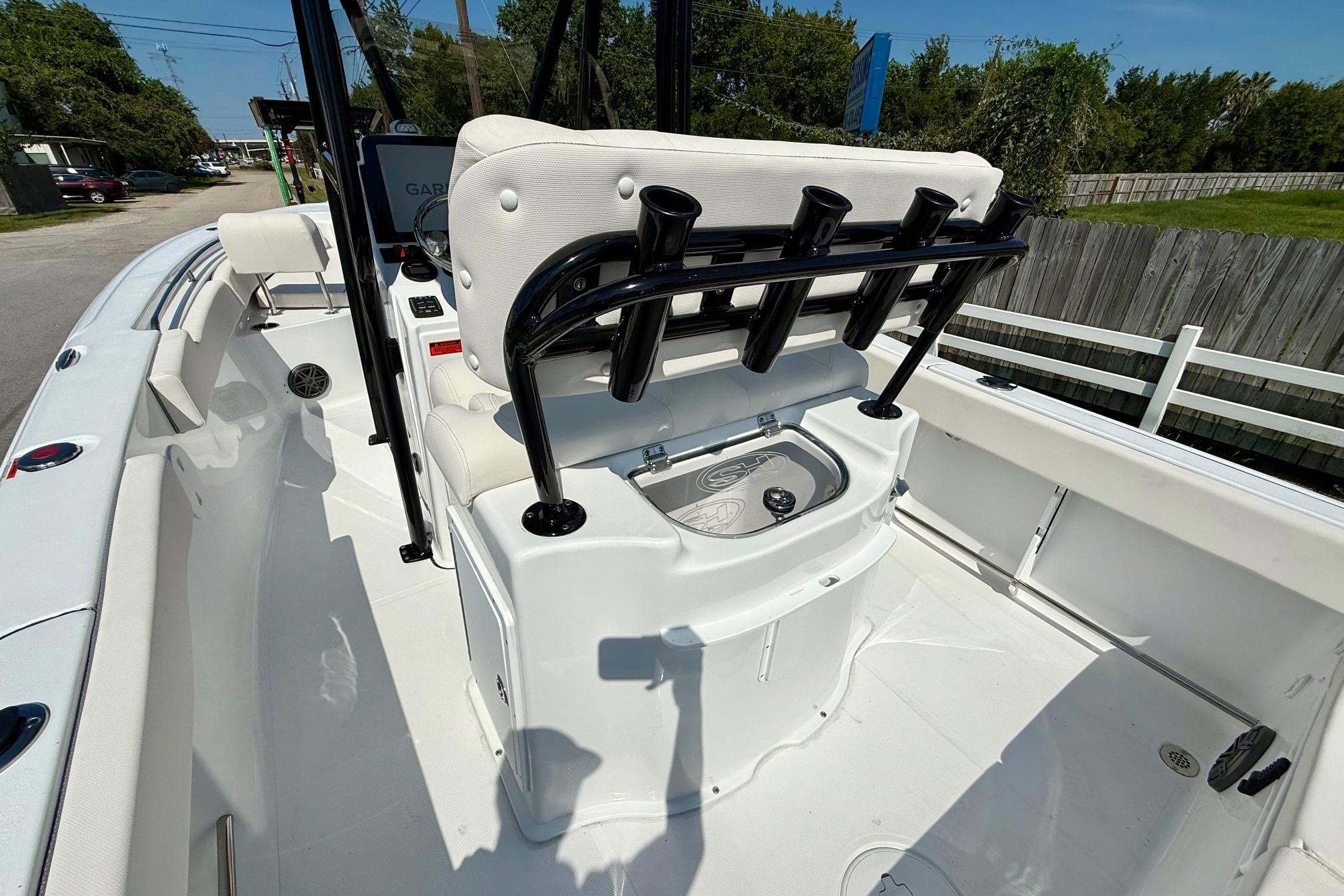 2026 Sea Hunt Ultra 229 boat interior with rod holders and seating.