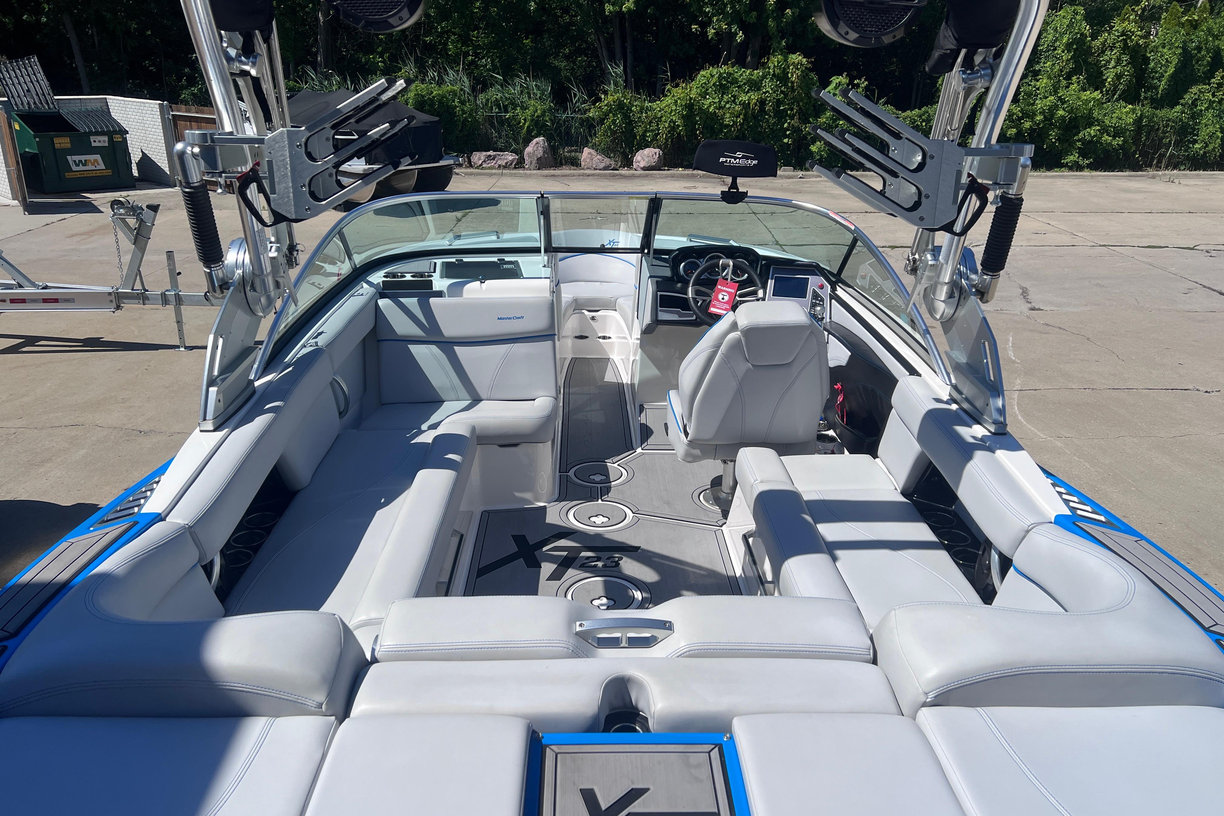 2021 MasterCraft XT23 boat interior with sleek seating and modern dashboard.