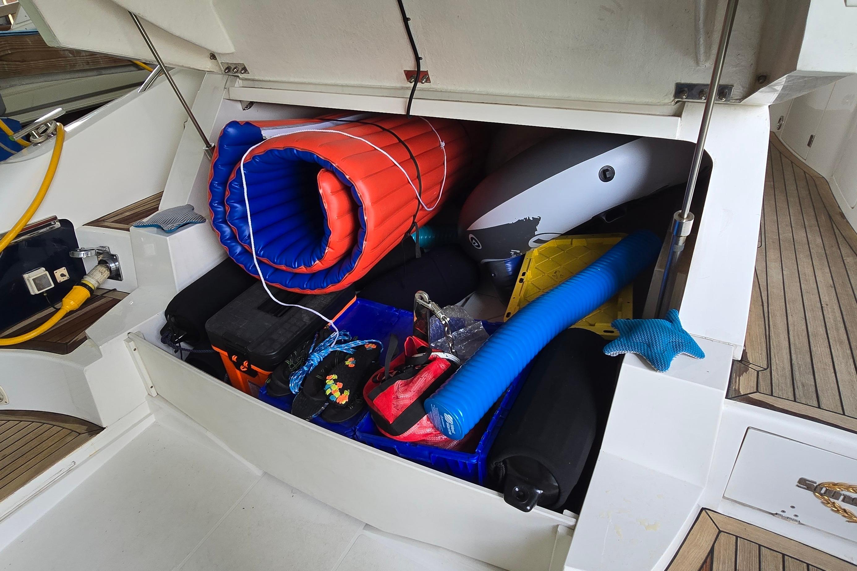 Storage compartment of a 2004 Sunseeker Camargue 50 yacht filled with boating accessories.