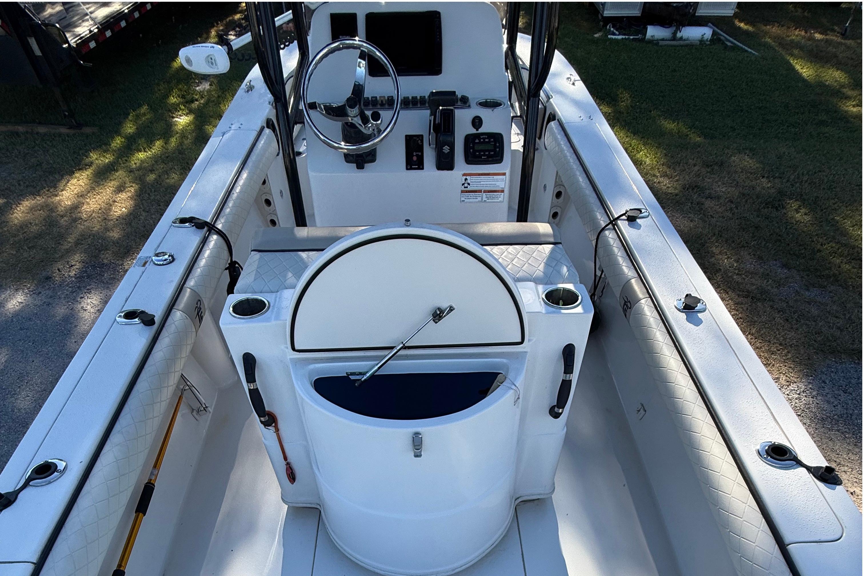 2021 Carolina Skiff 26 Ultra Elite boat interior with steering console and seating.