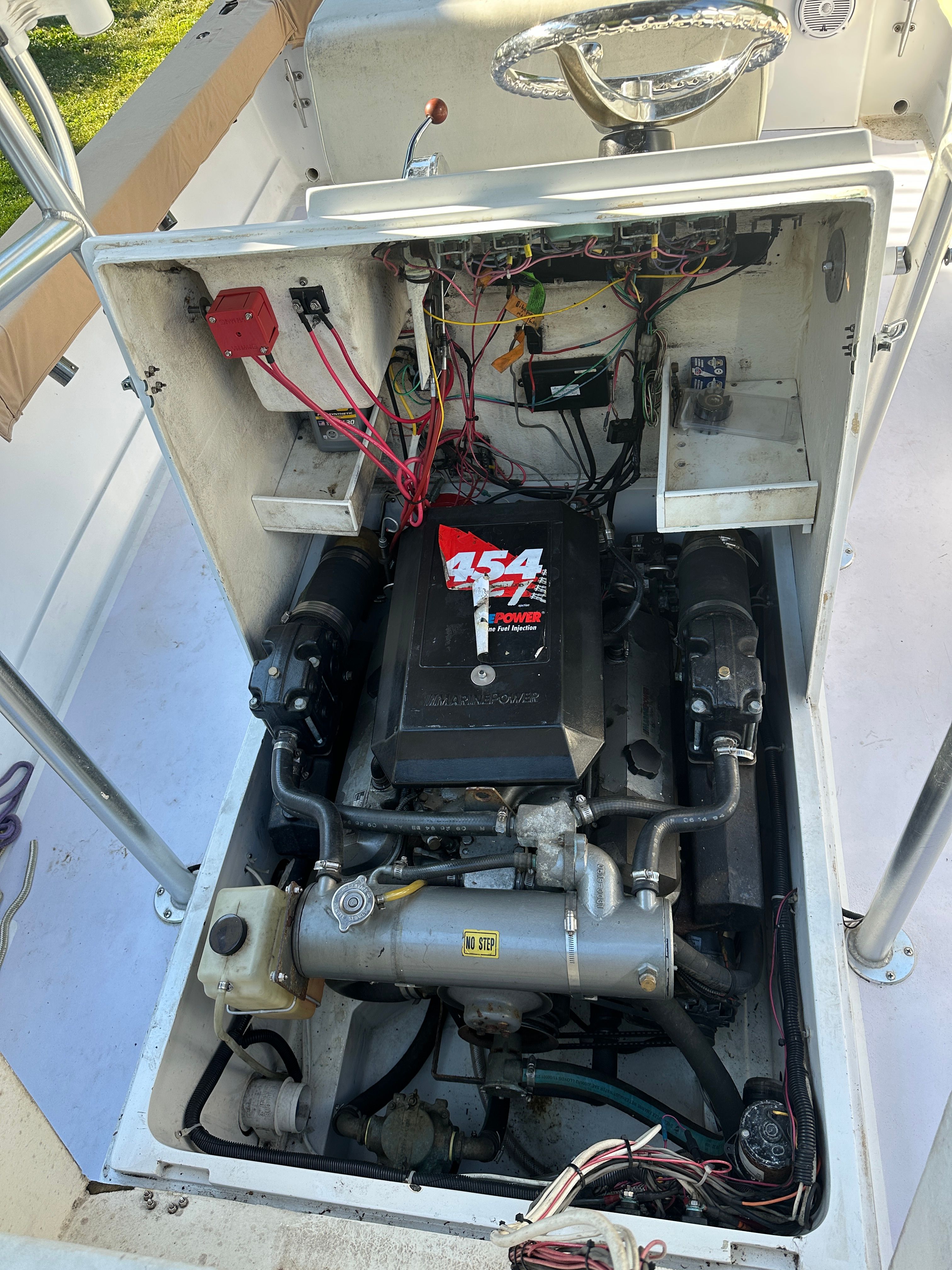 Engine compartment of a 1976 Blackfin Fisherman boat featuring a 454 engine.