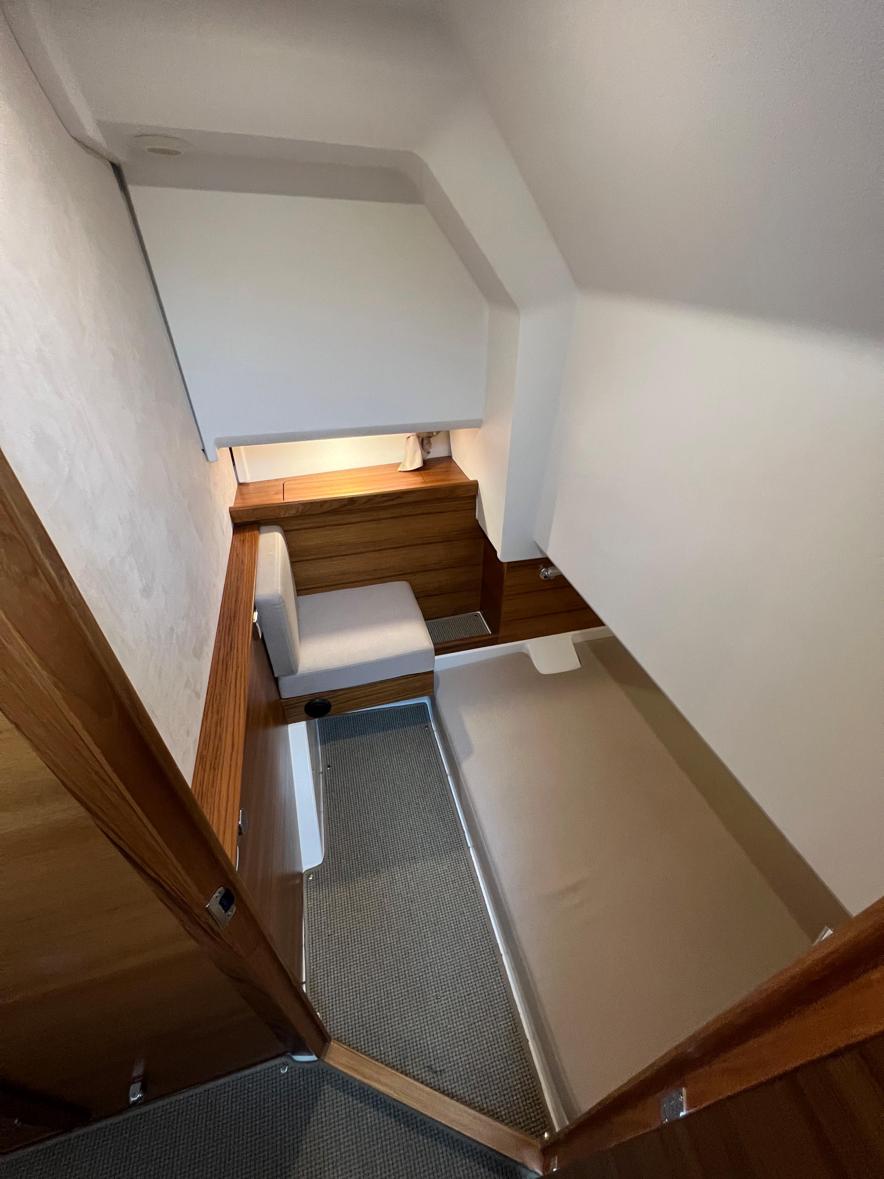 Interior cabin of 2021 Nimbus Tender 11, featuring modern design and cozy sleeping area.
