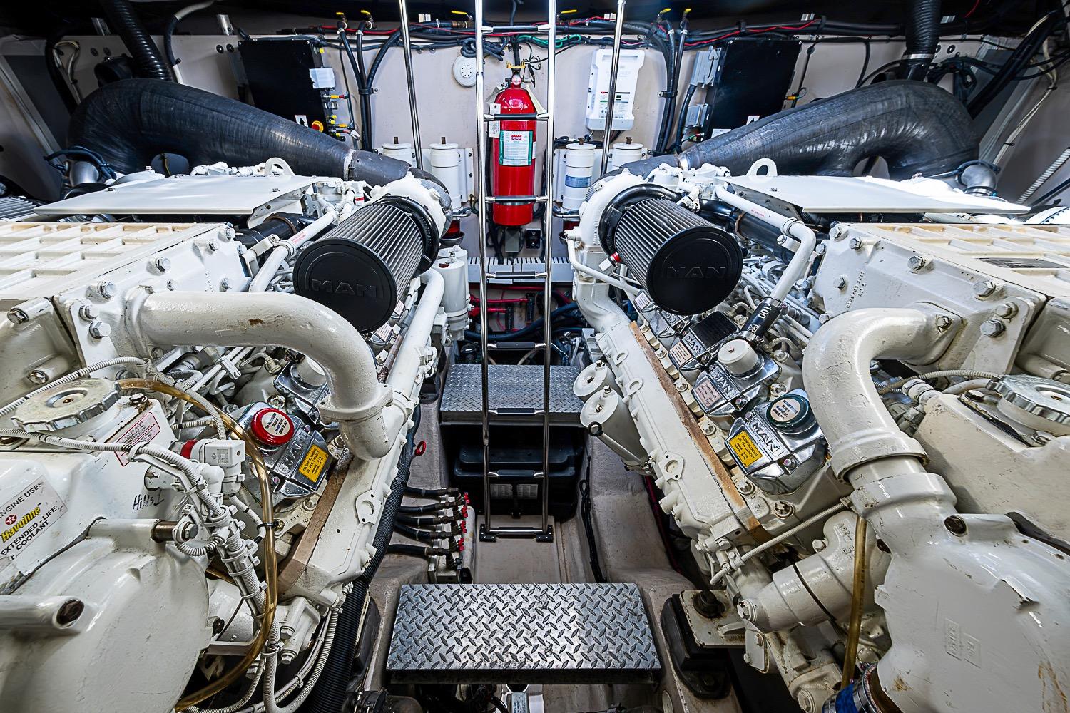 Engine room of a 2008 Sea Ray 60 Sundancer yacht, featuring dual MAN engines.