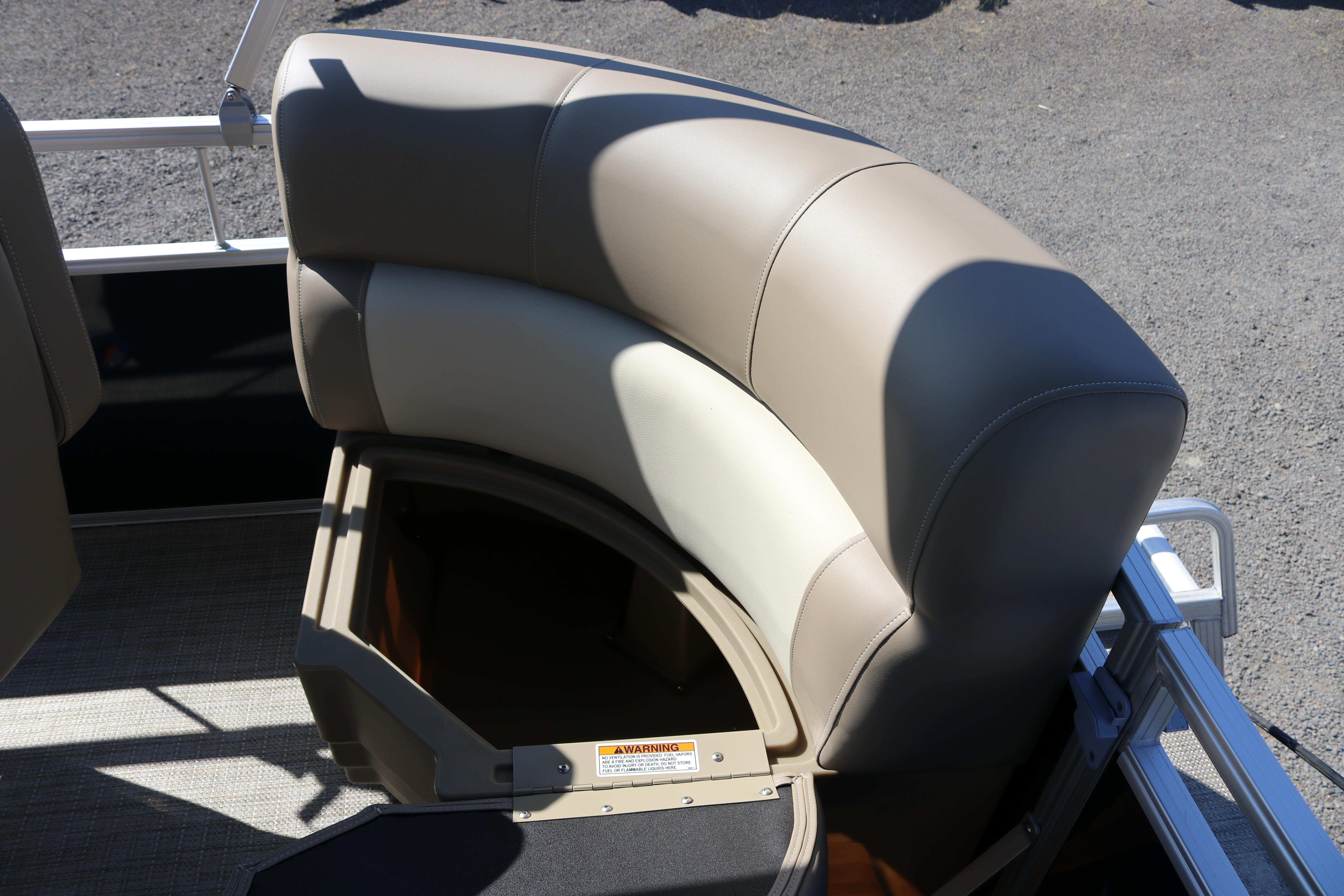2025 Sun Chaser Vista Fish 18 boat seat with storage compartment open.