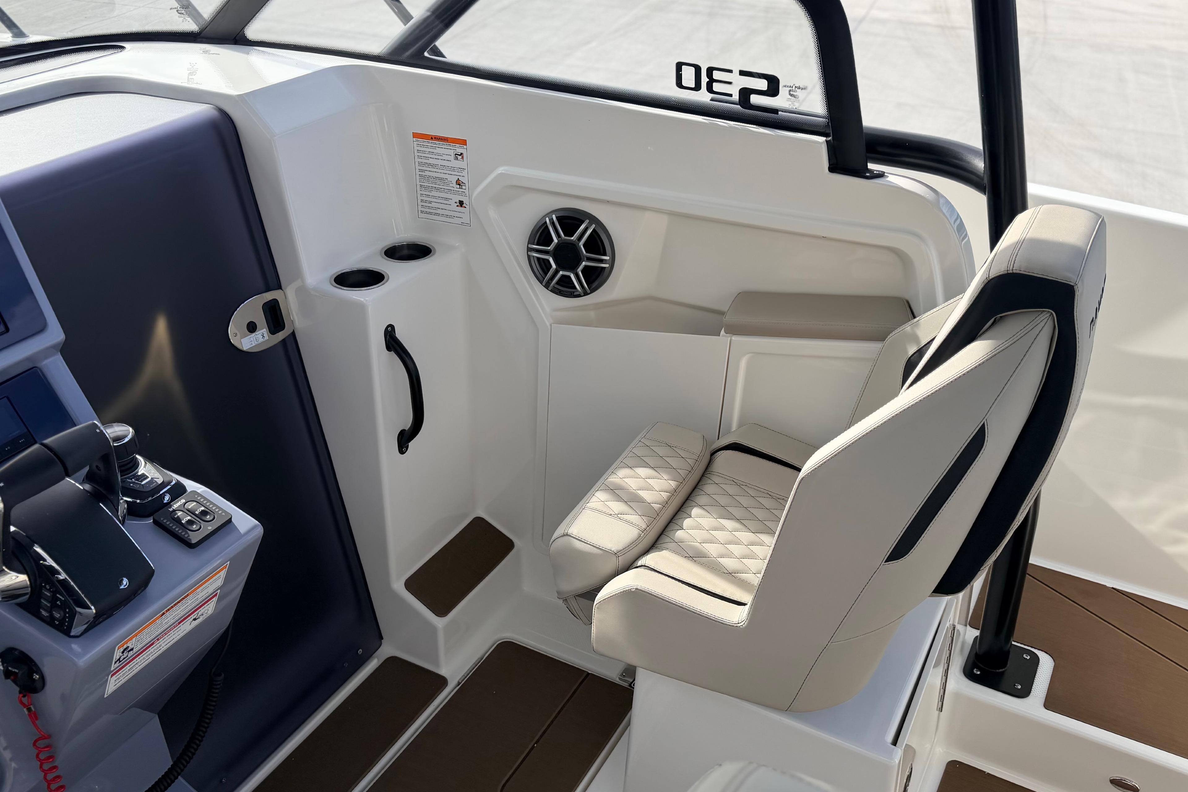 Interior of 2026 Navan S30 boat with modern seating and control panel.