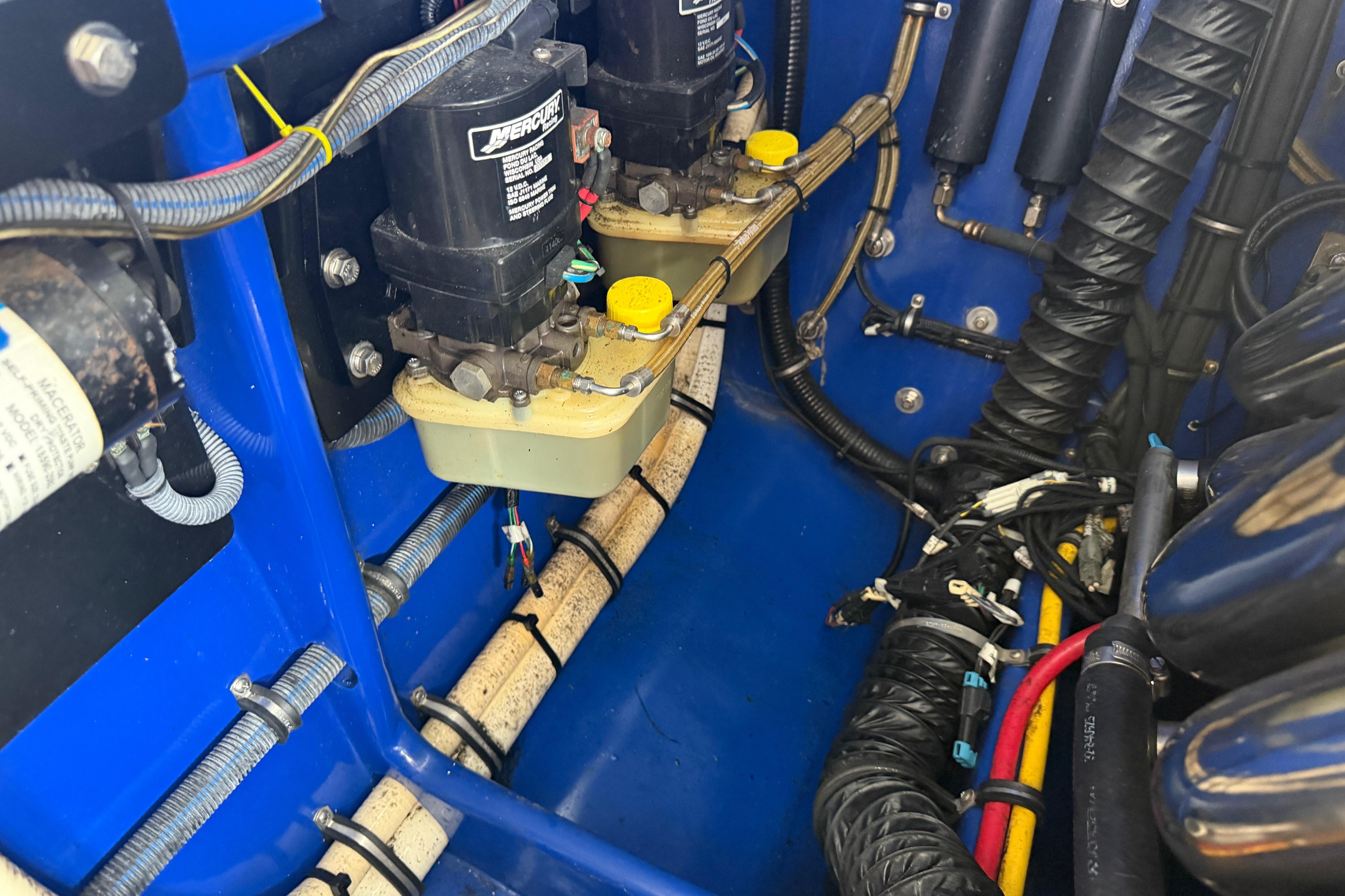 Engine compartment of a 2013 Nor-Tech 477 SPX Vee Bottom boat, showcasing mechanical components.