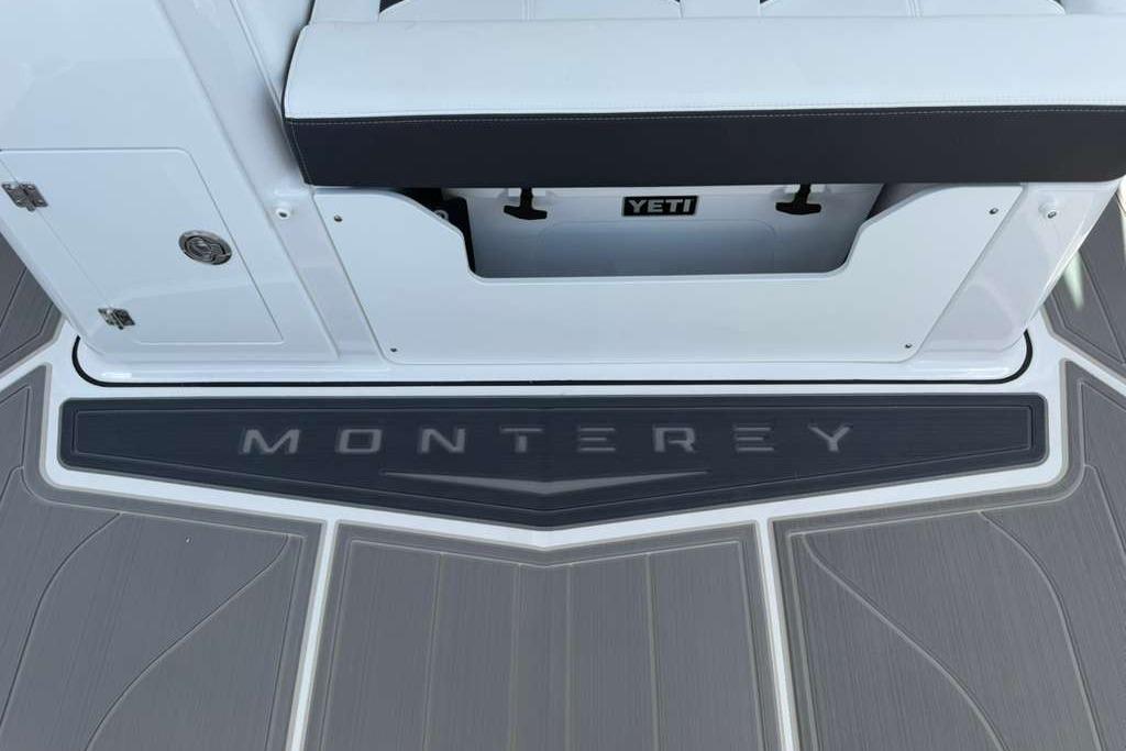 2026 Monterey Elite 30 OB boat deck with Yeti cooler storage.