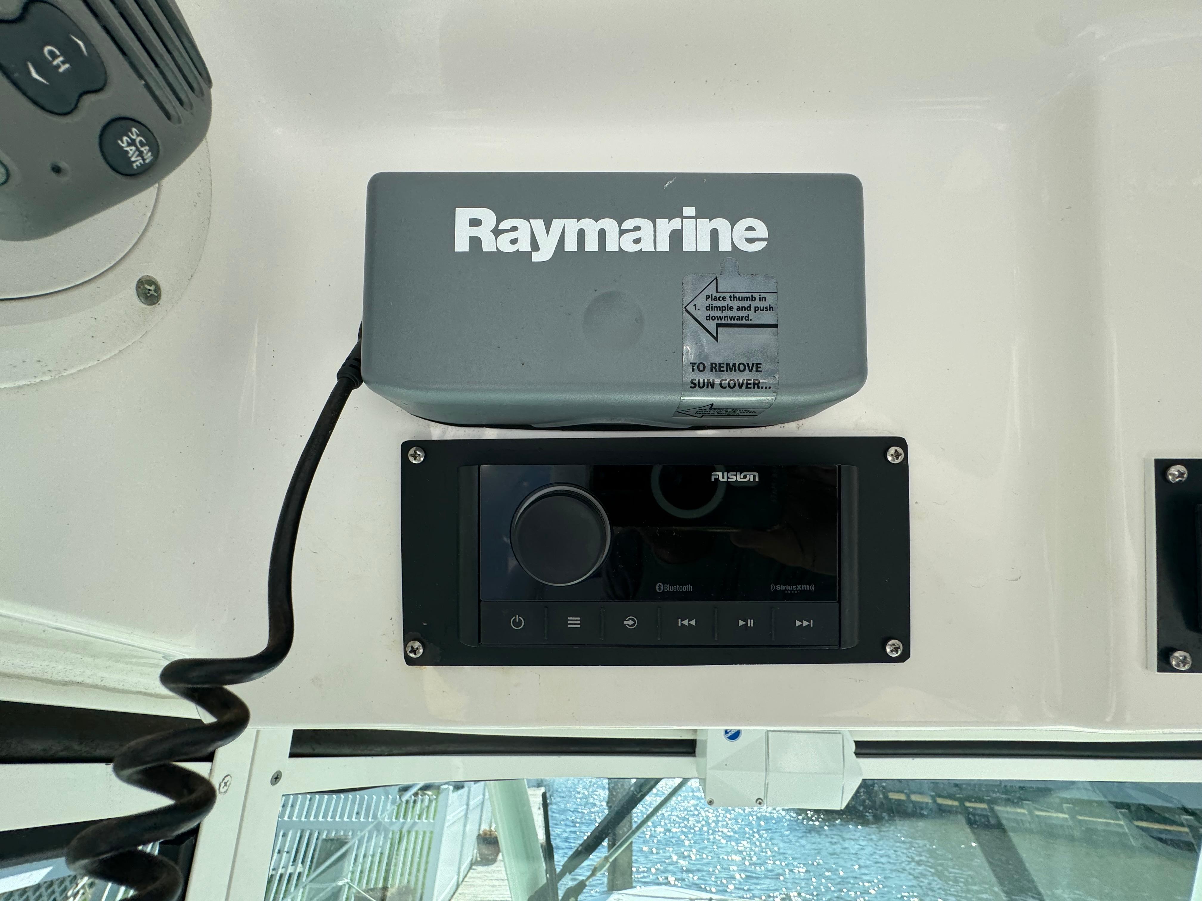 Raymarine and Fusion equipment on 2011 Everglades 325 Center Console boat dashboard.