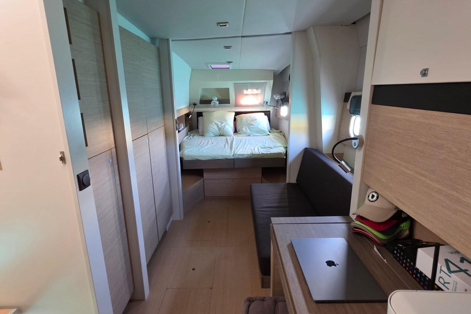 Interior of a 2016 Bali 4.5 yacht with cozy bedroom and modern furnishings.