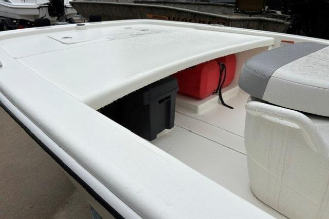 2025 Mako Pro Skiff 13 CC boat deck with storage compartments and seating.
