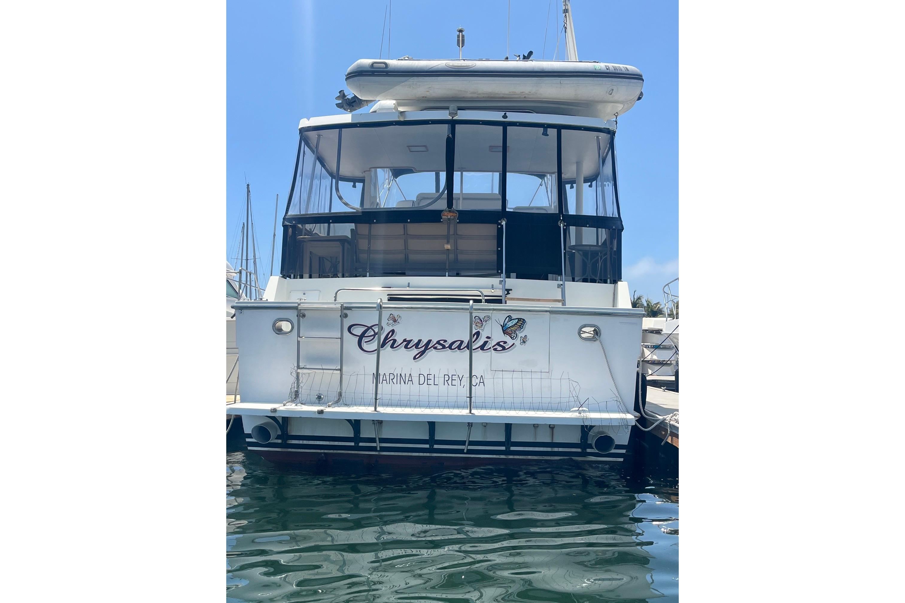 1989 Ocean Alexander 440 Sundeck CPMY docked at Marina del Rey, rear view.