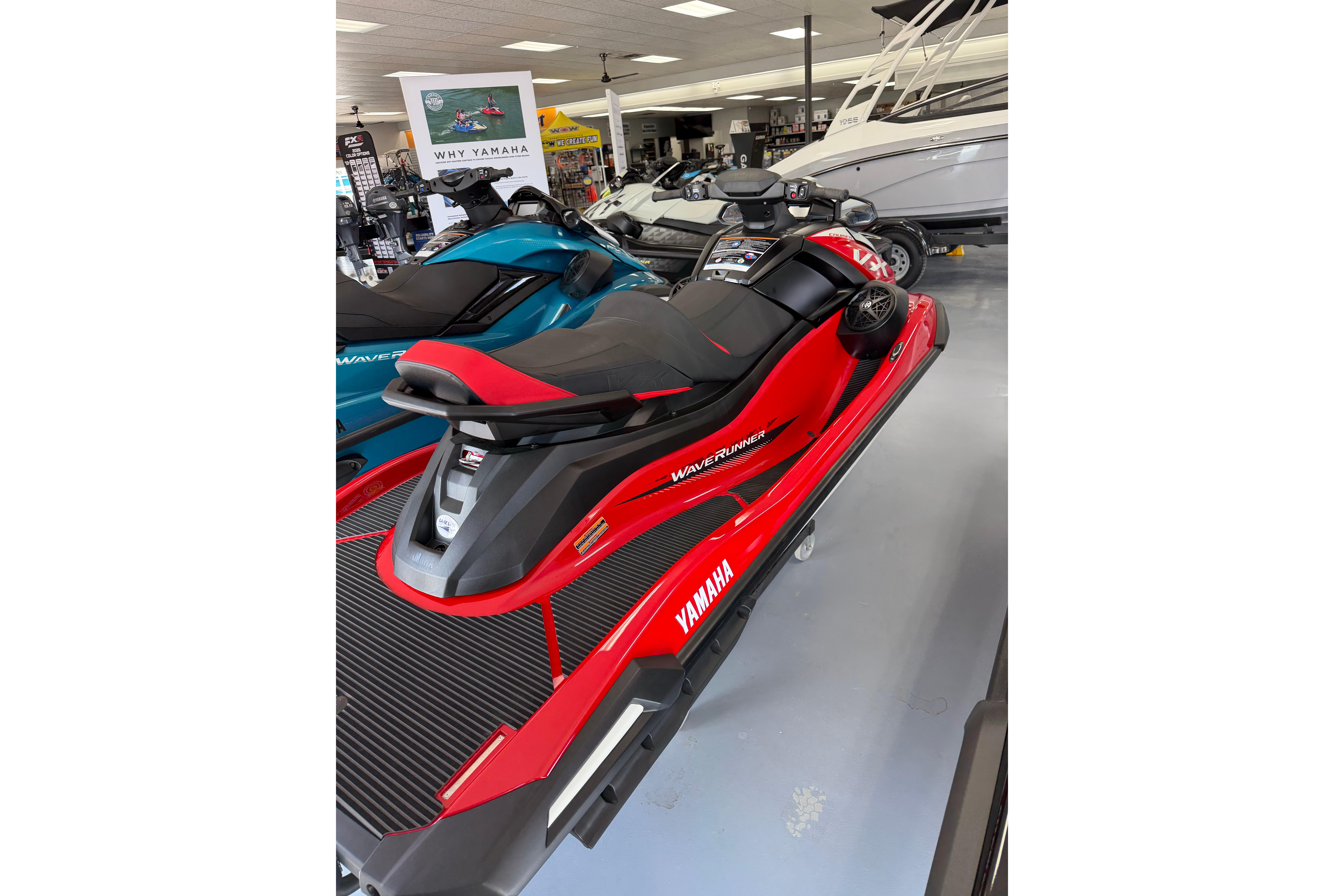 2026 Yamaha WaveRunner VX Cruiser in showroom, red and black design, sleek and modern.