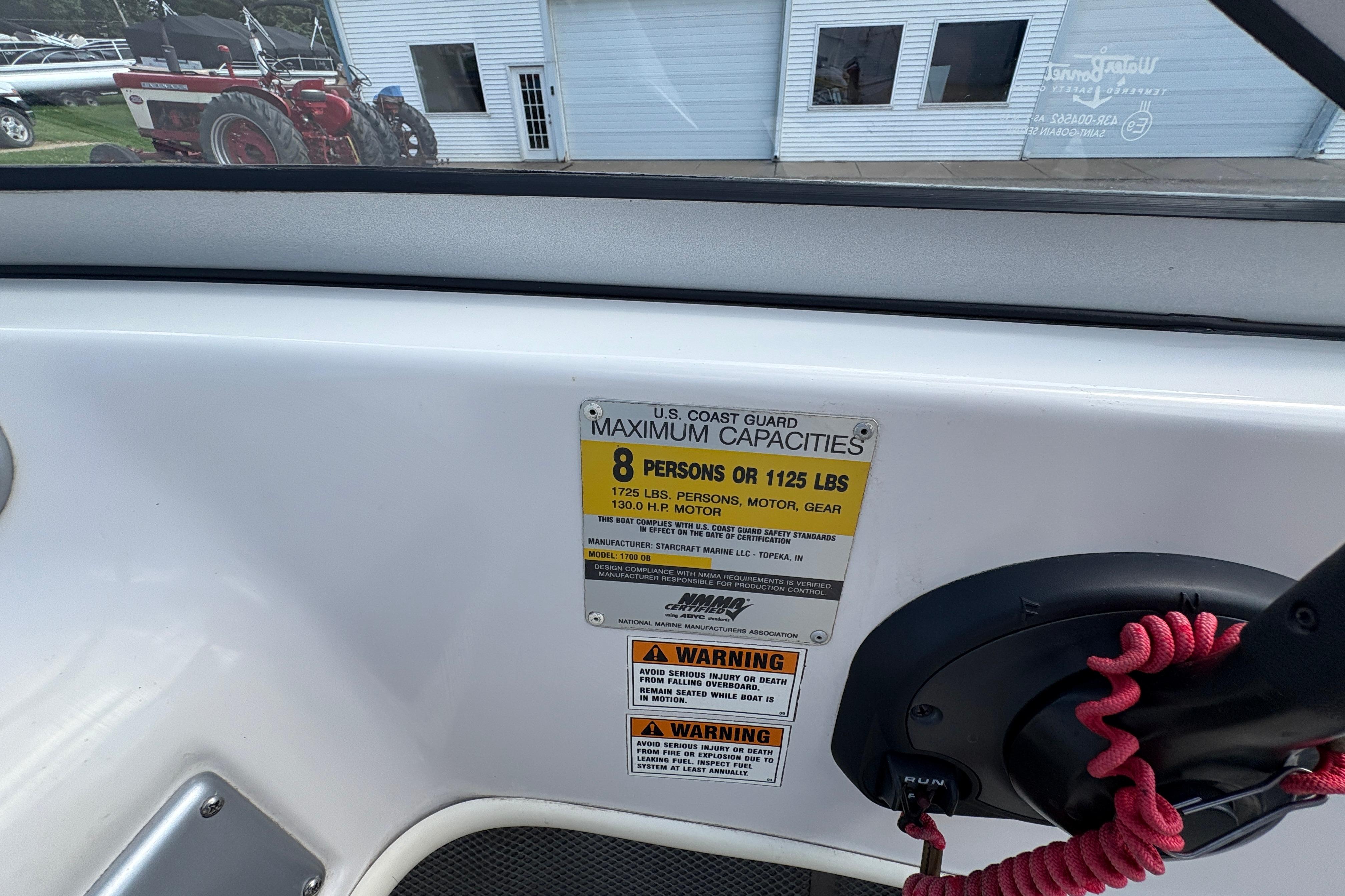 2005 Starcraft C-Star 1700 OB boat capacity label, showing maximum weight and passenger limits.