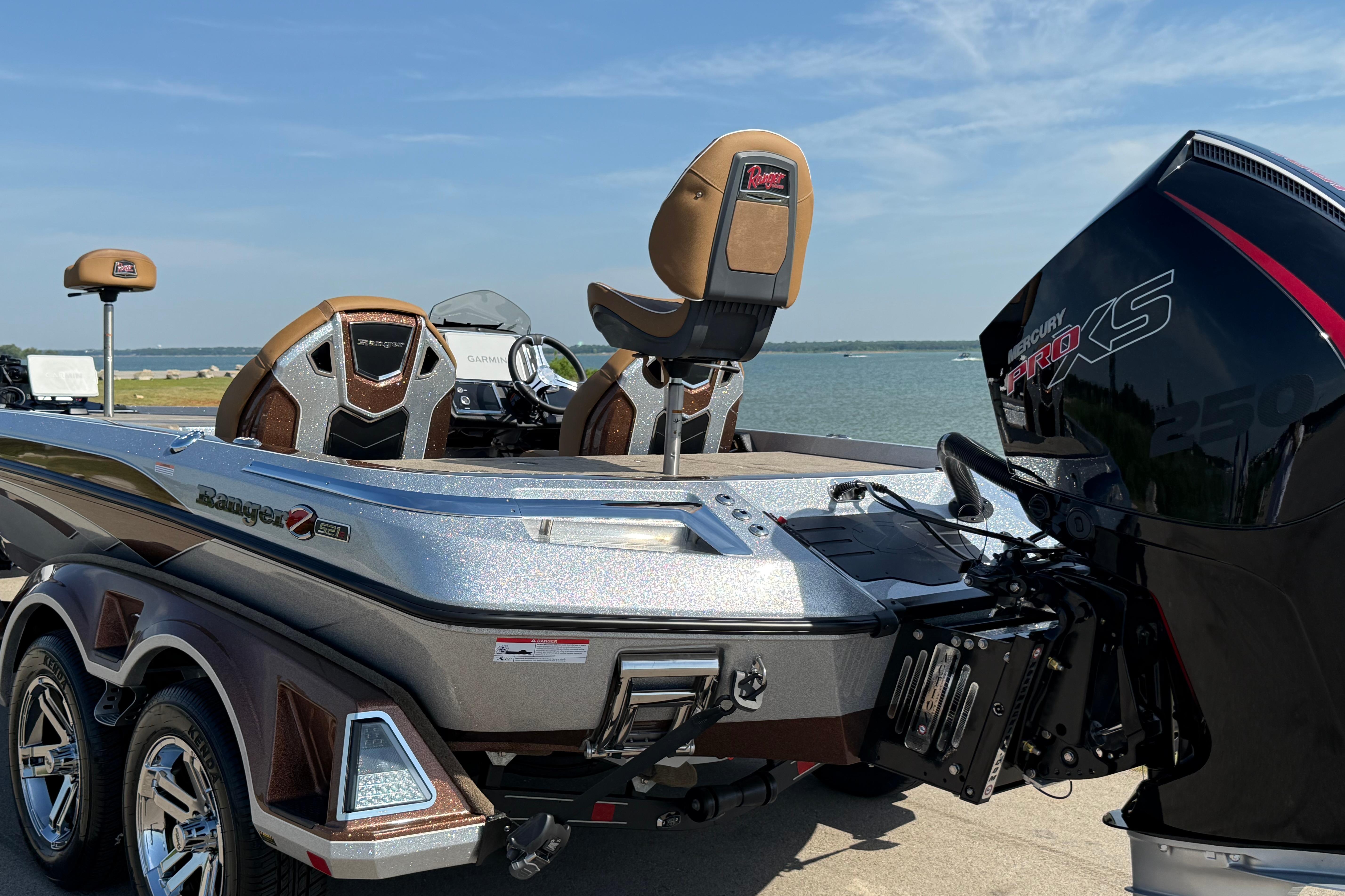 2026 Ranger Z521R boat with Mercury Pro XS engine by a lake.