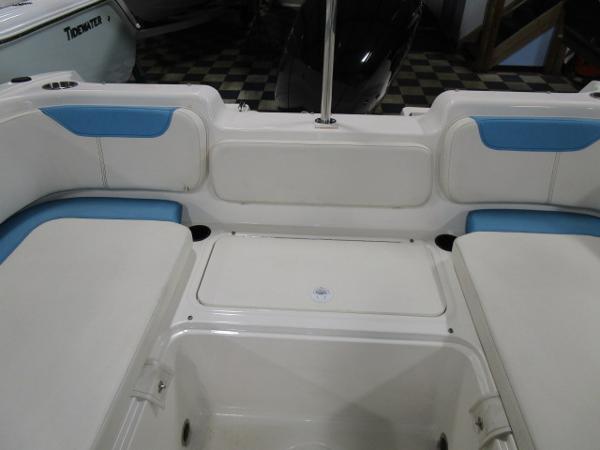 2023 Bayliner 210EL boat interior with blue and white seating.