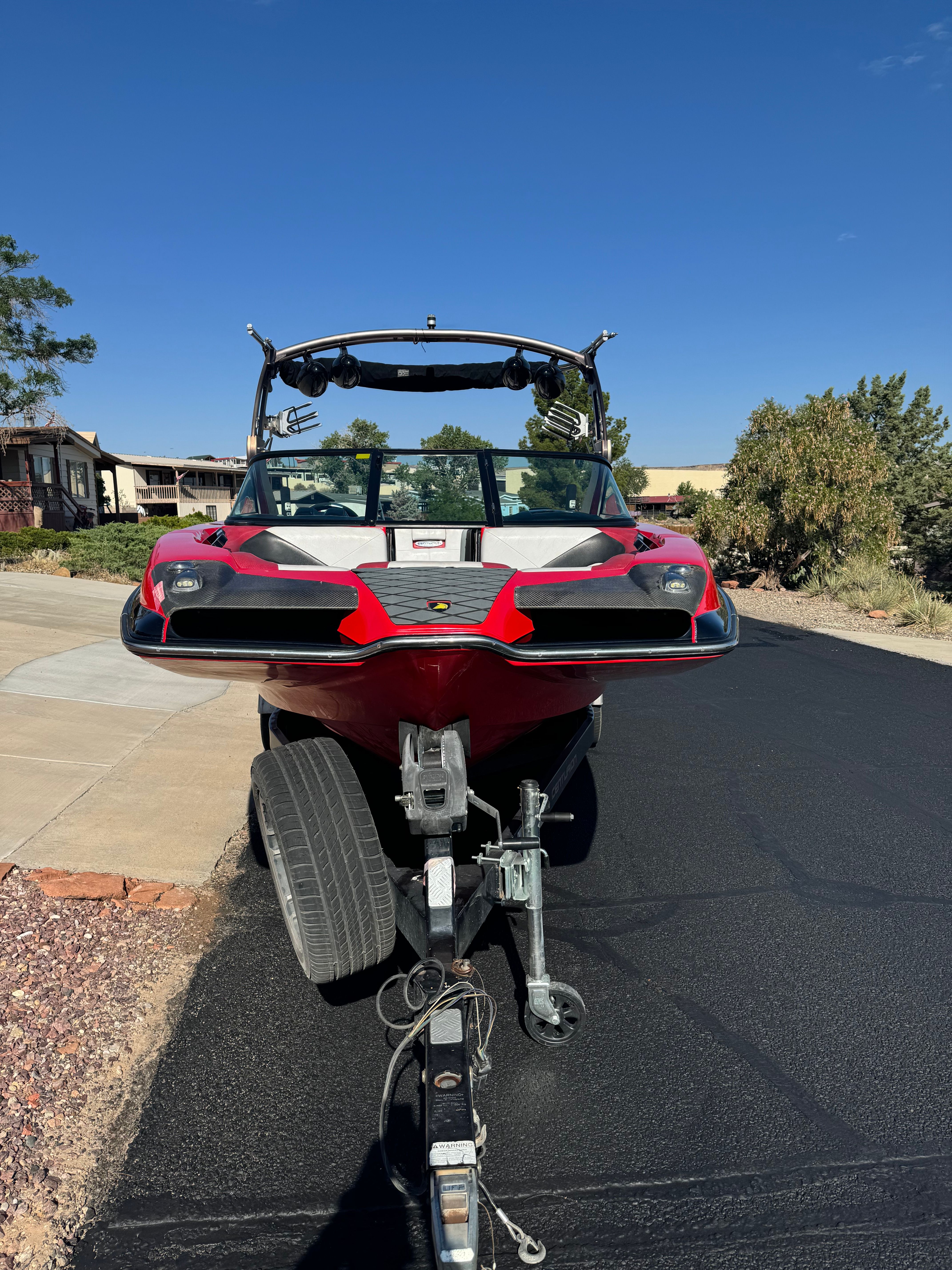 2014 Centurion Enzo FX44 boat on trailer, red design.