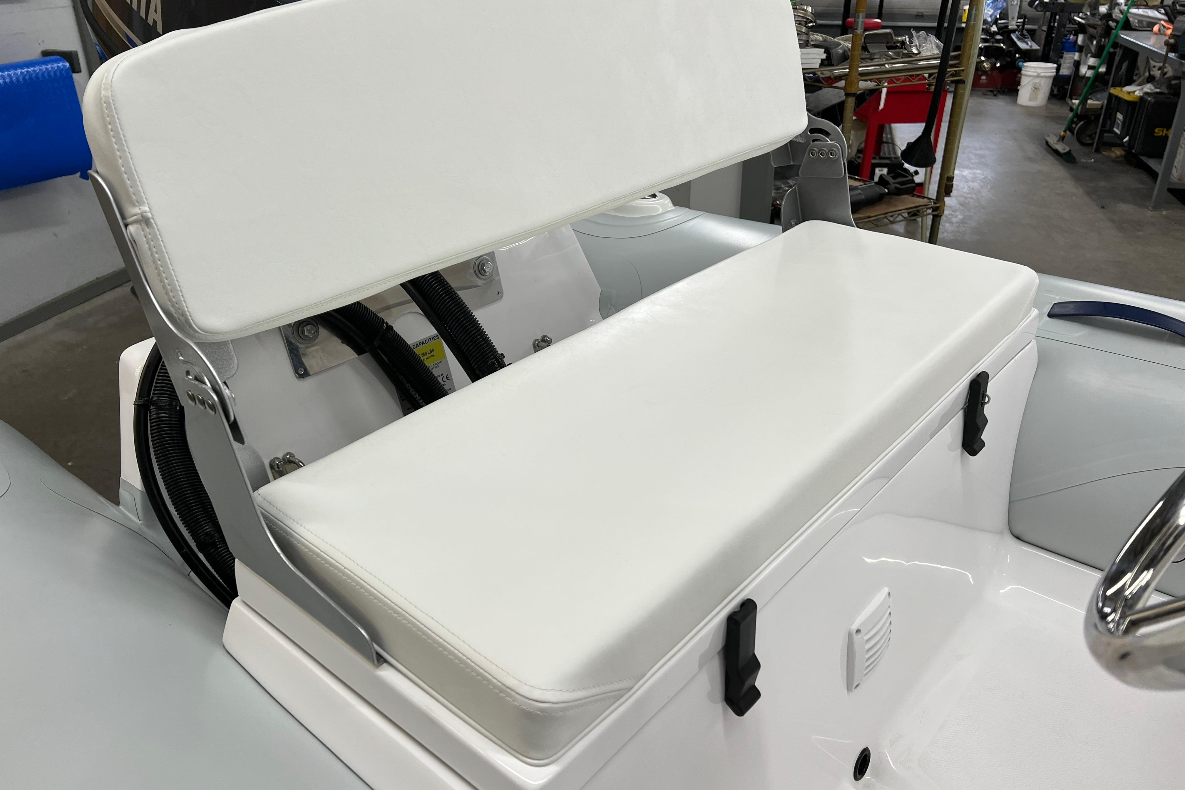 2023 AB Inflatables Mares 11 VSX boat seat with white cushioned backrest.