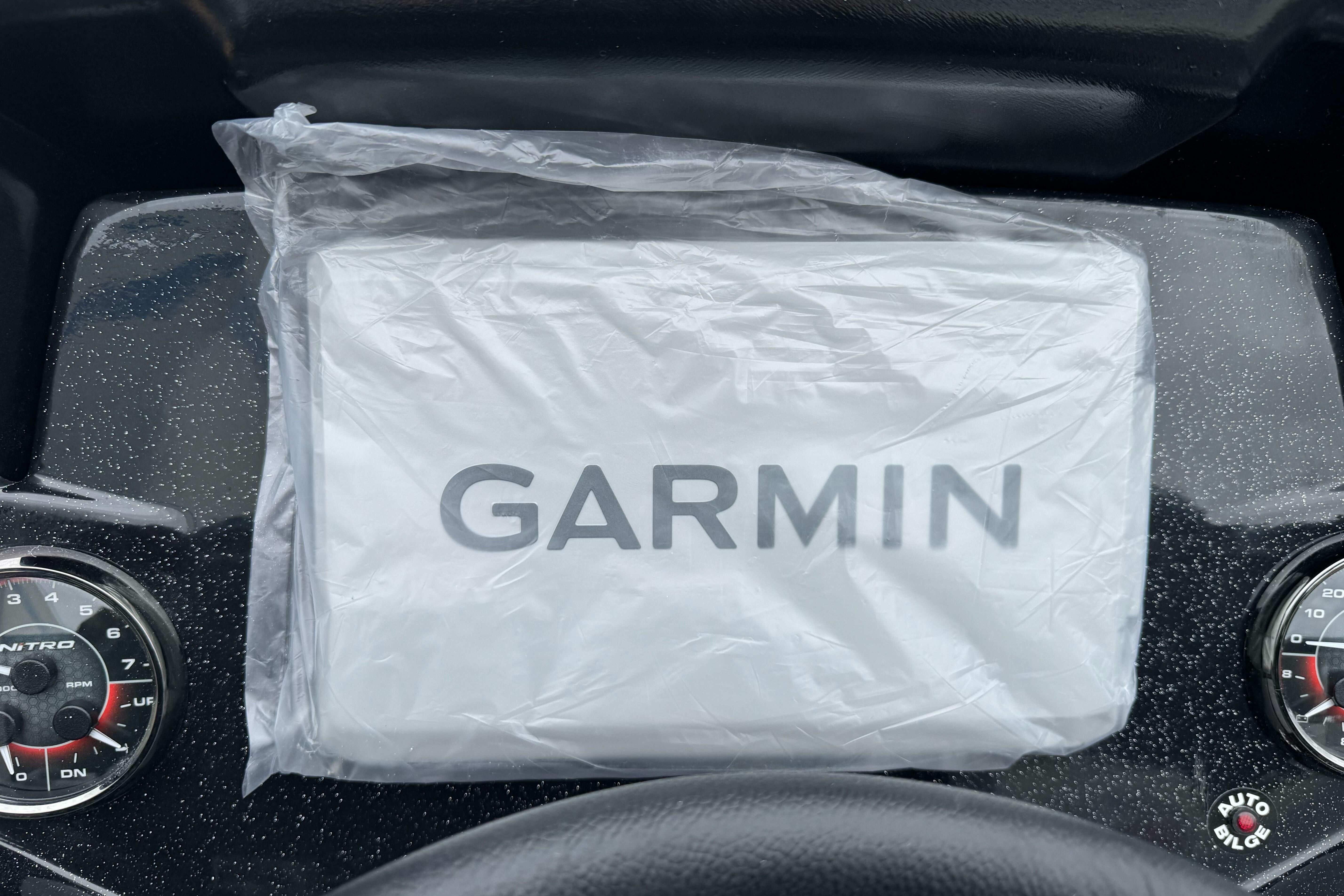 Garmin device on Nitro Z20 XL Pro 2026 dashboard, wrapped in protective plastic.