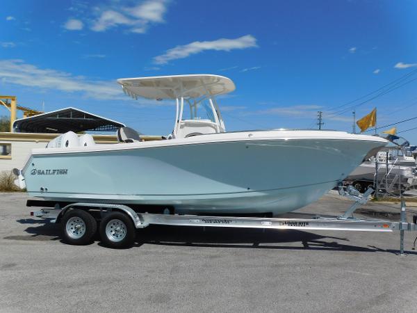 2024 Sailfish 242 CC boat on a trailer under a clear blue sky.