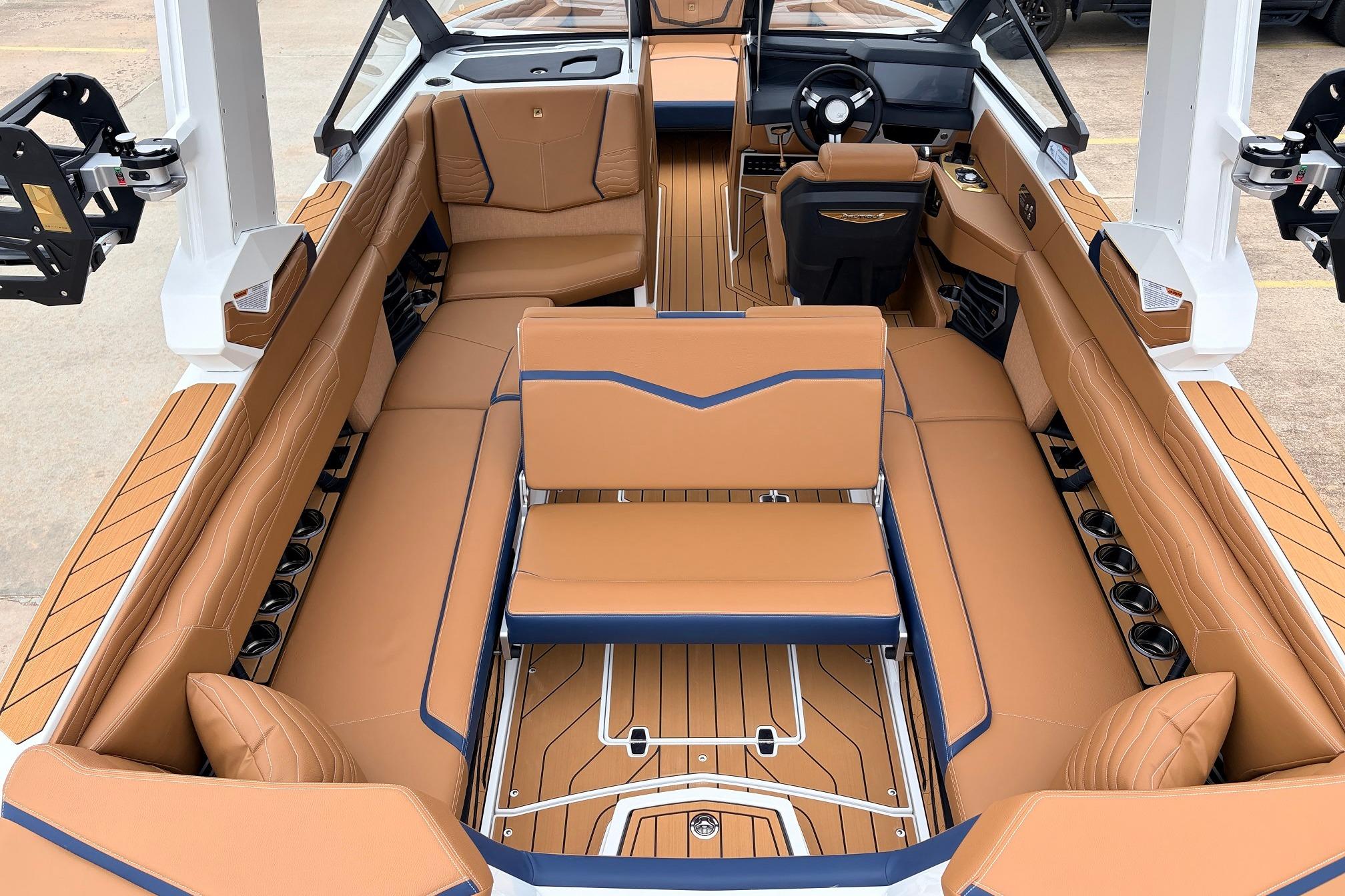 Luxurious interior of 2026 Nautique Super Air Nautique G25 boat with tan seating and modern design.