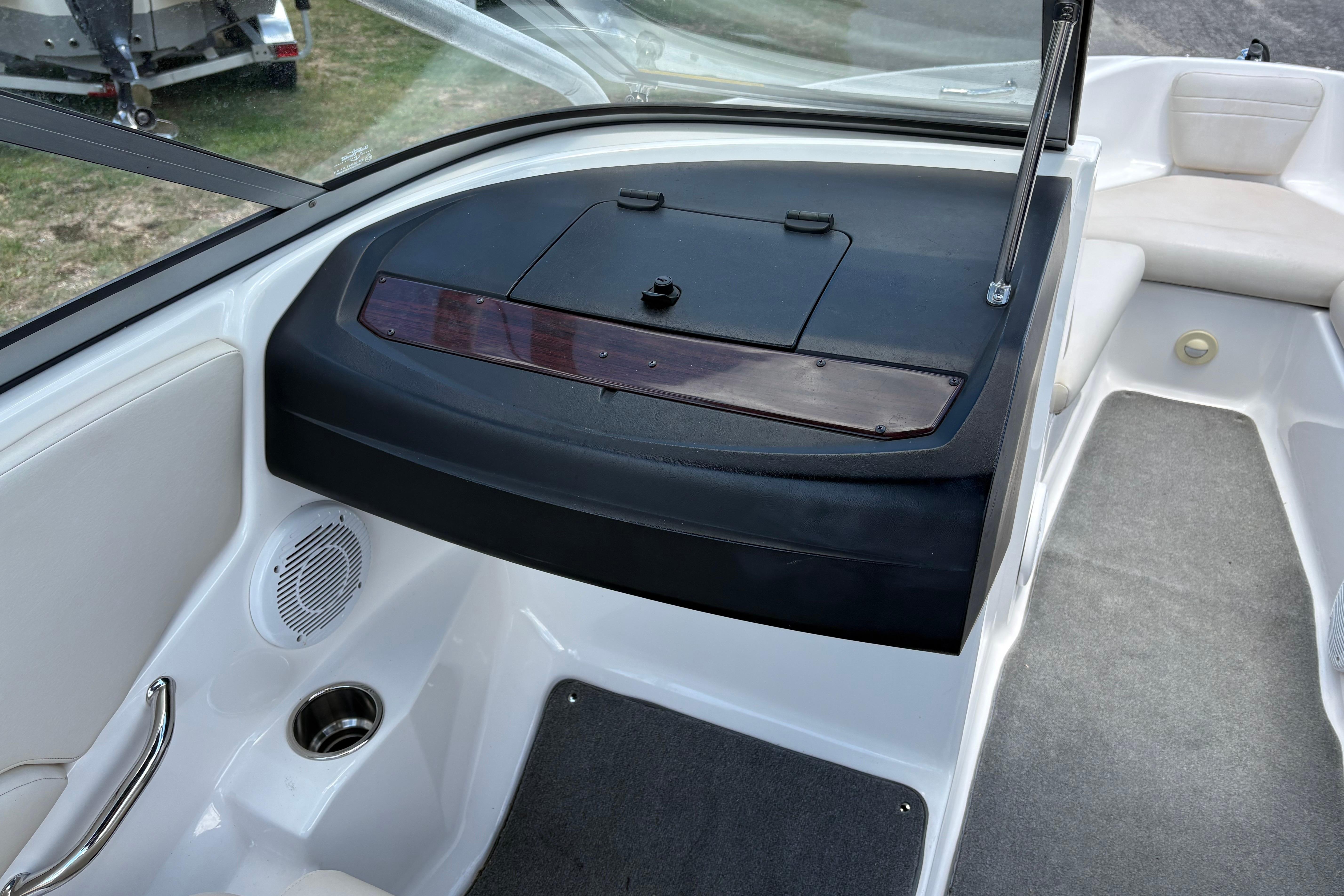 2008 Regal 1900 Bowrider interior with dashboard, speaker, and seating area.