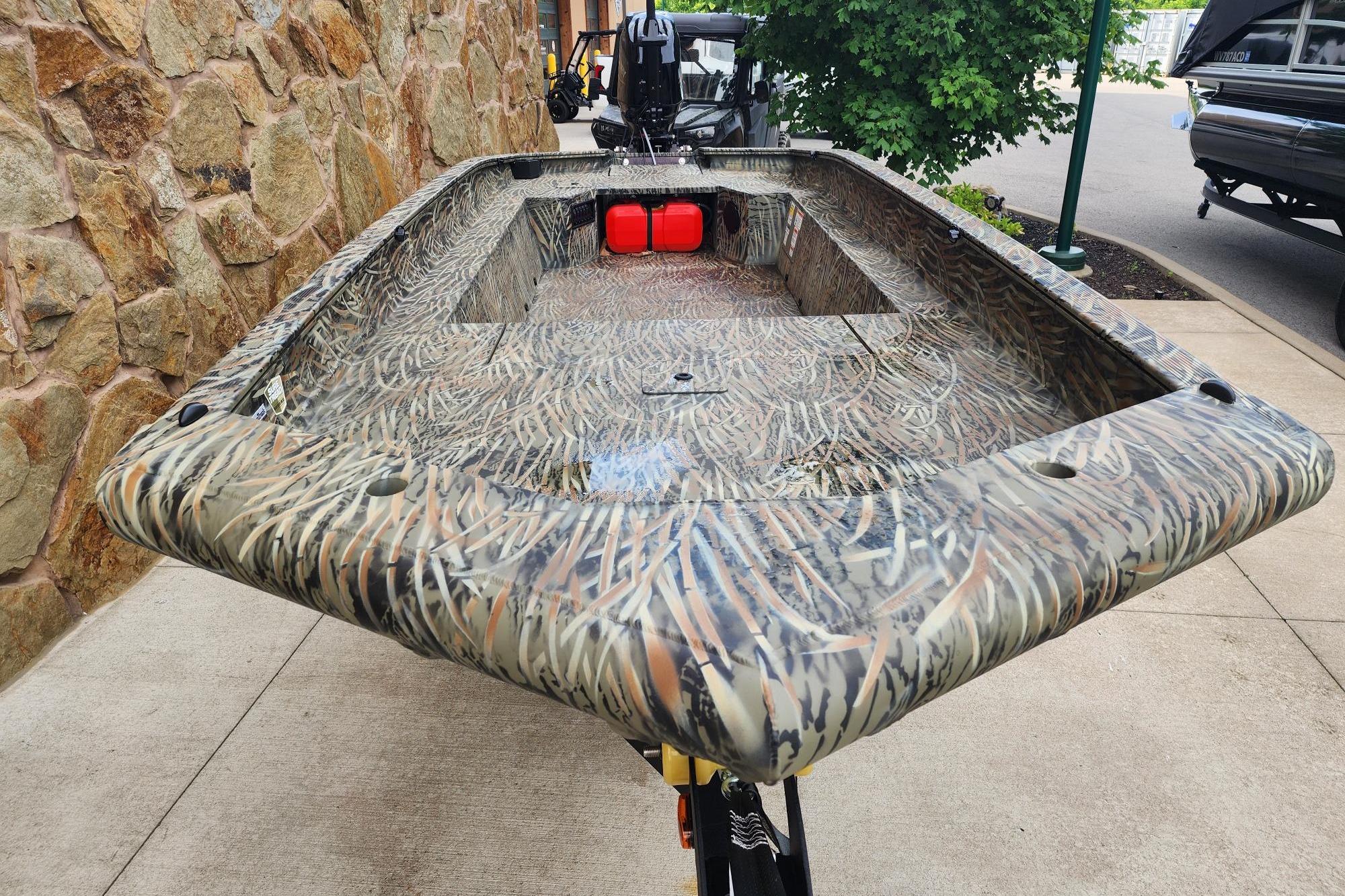 2026 Tracker Grizzly 1650 T Prairie Wings Edition boat with camouflage design.