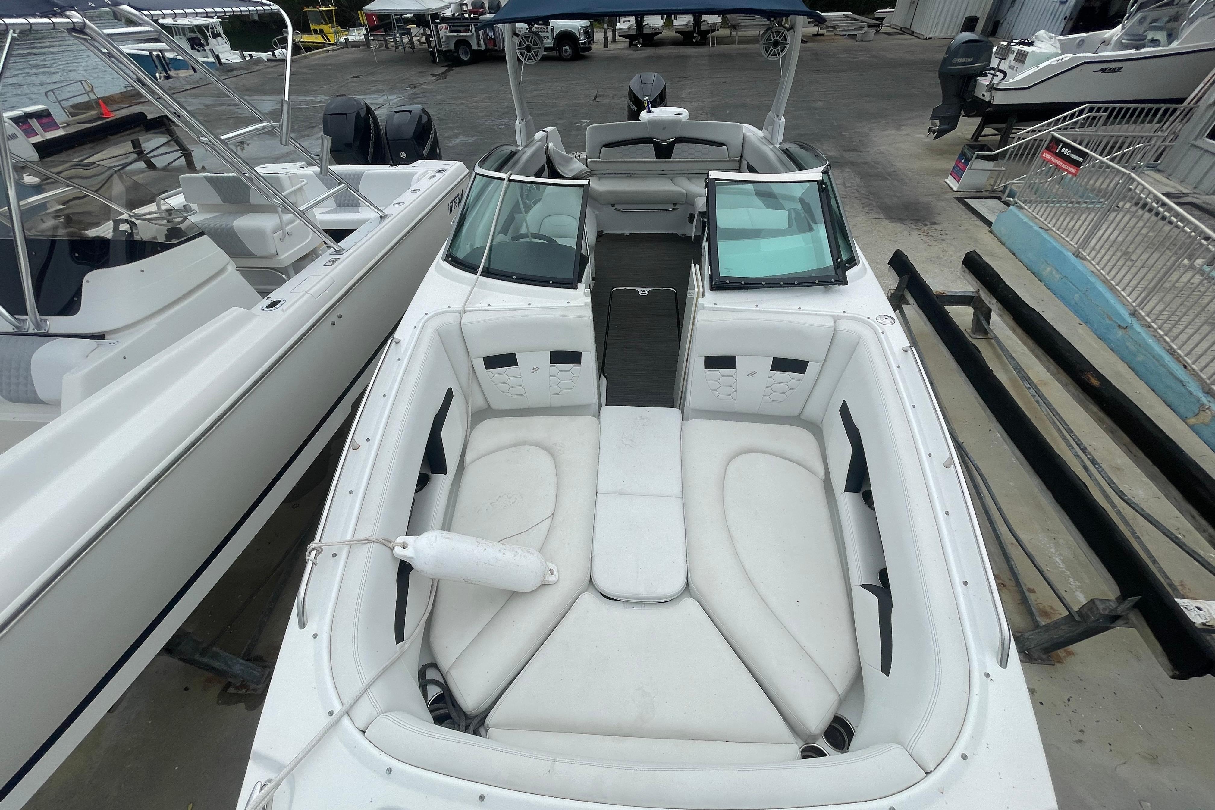 2022 Four Winns HD8 OB boat with spacious white seating and sleek design.