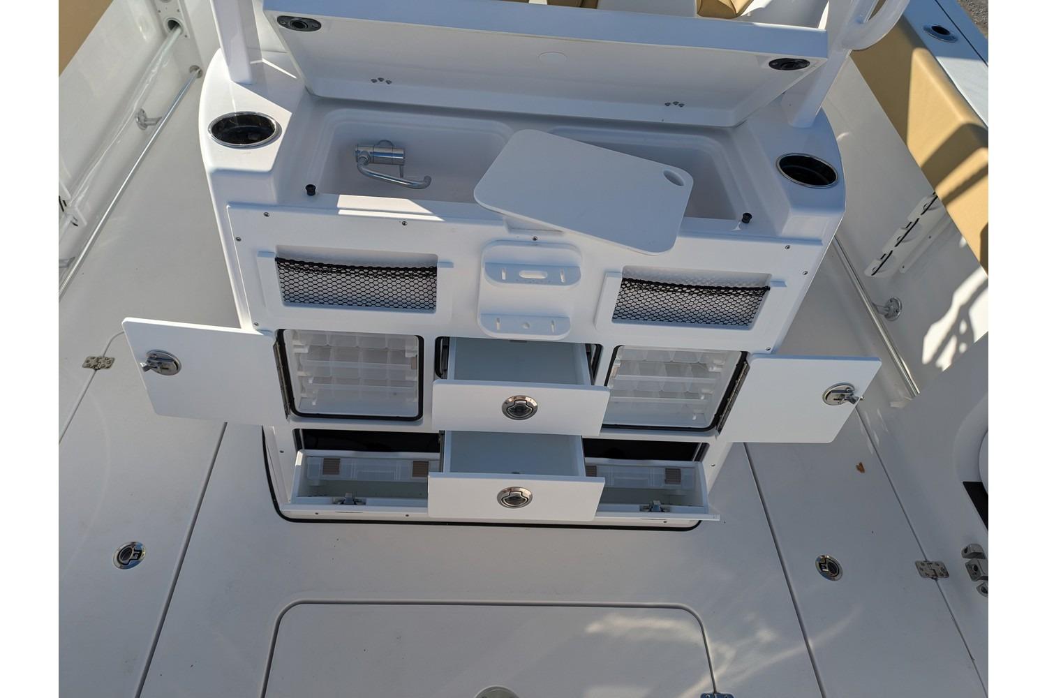 2025 Sportsman Open 282 Center Console boat interior with storage compartments open.