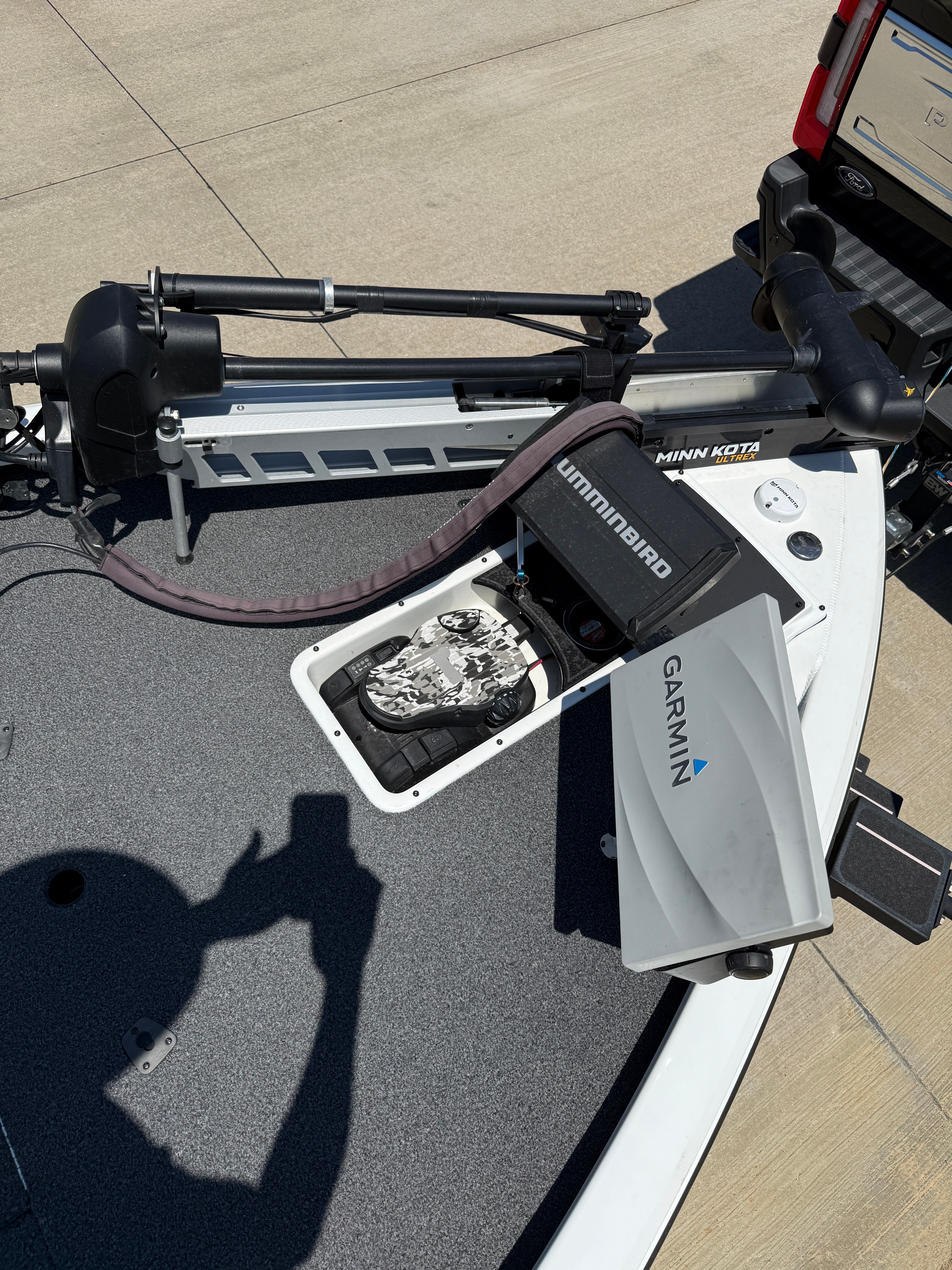 Bow deck of a Vexus AVX1980 boat with Minn Kota motor and Garmin device.
