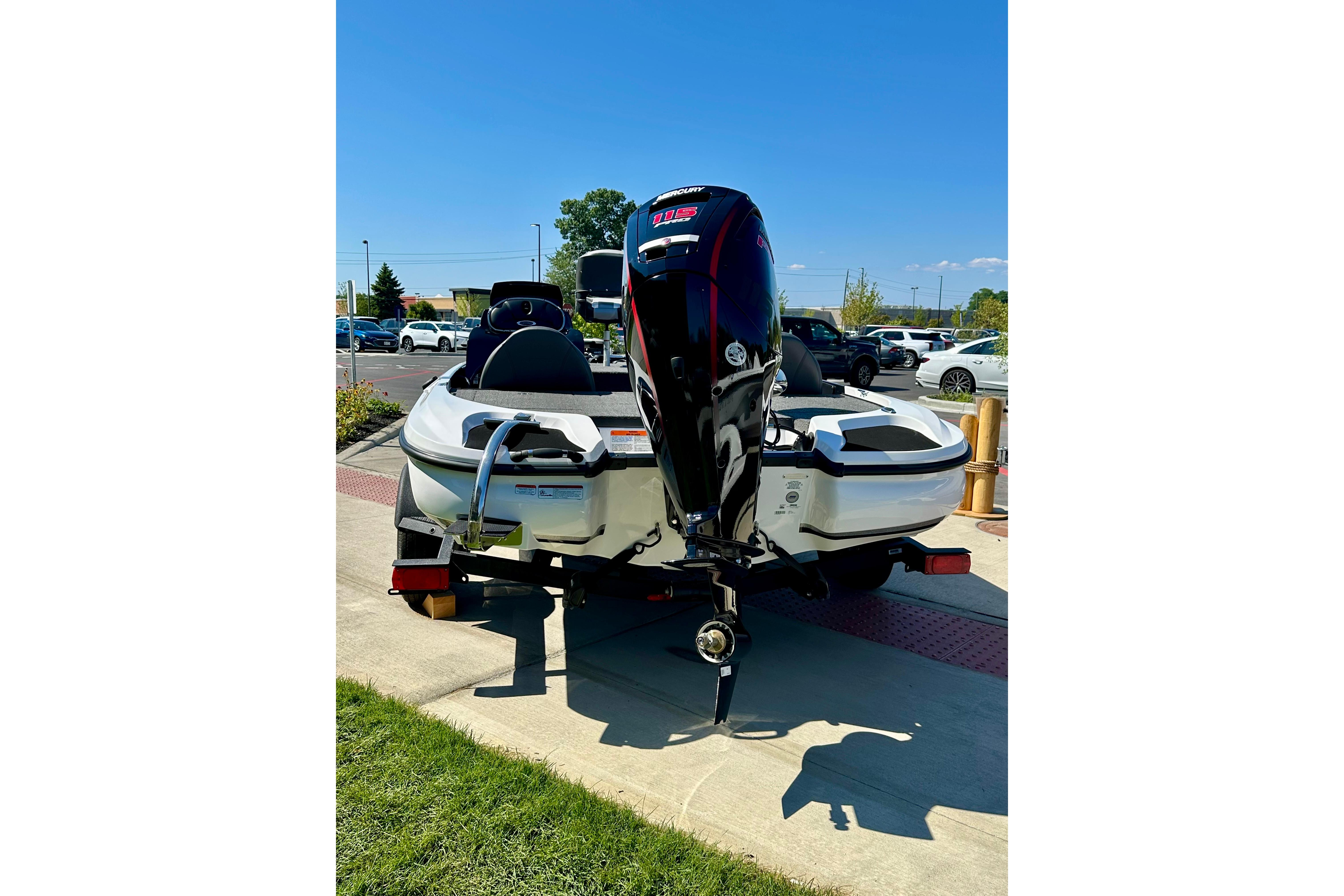 2026 Nitro Z17 boat with powerful outboard motor, parked outdoors on a sunny day.