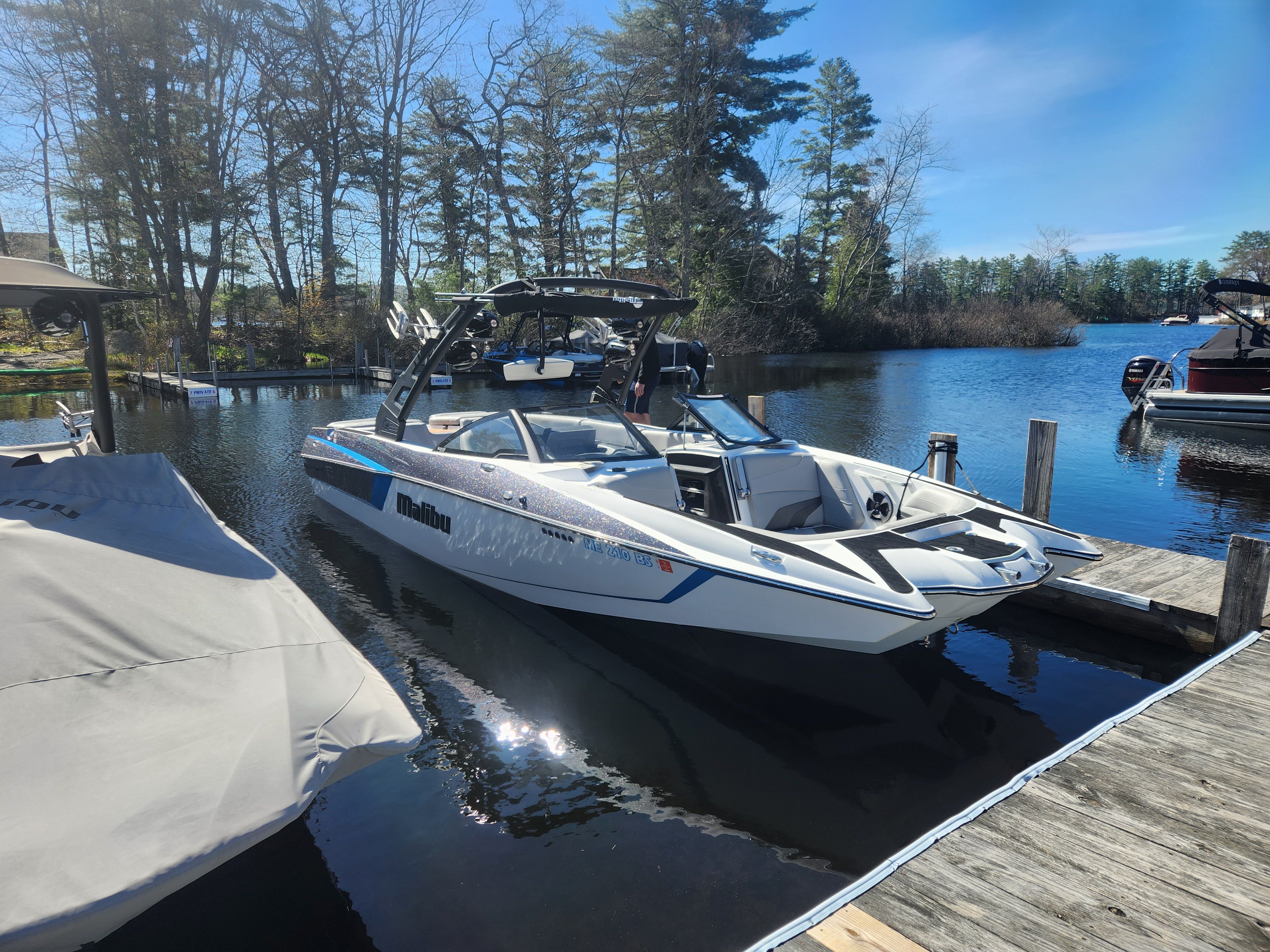 2017 Malibu Wakesetter 24 MXZ docked at lakeside.