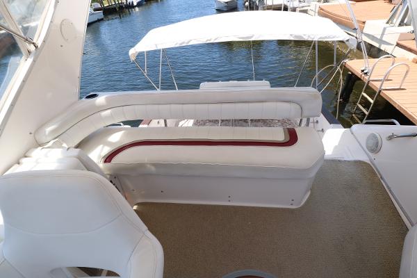 1992 Sea Ray 350 Express Bridge boat interior with white seating and water view.