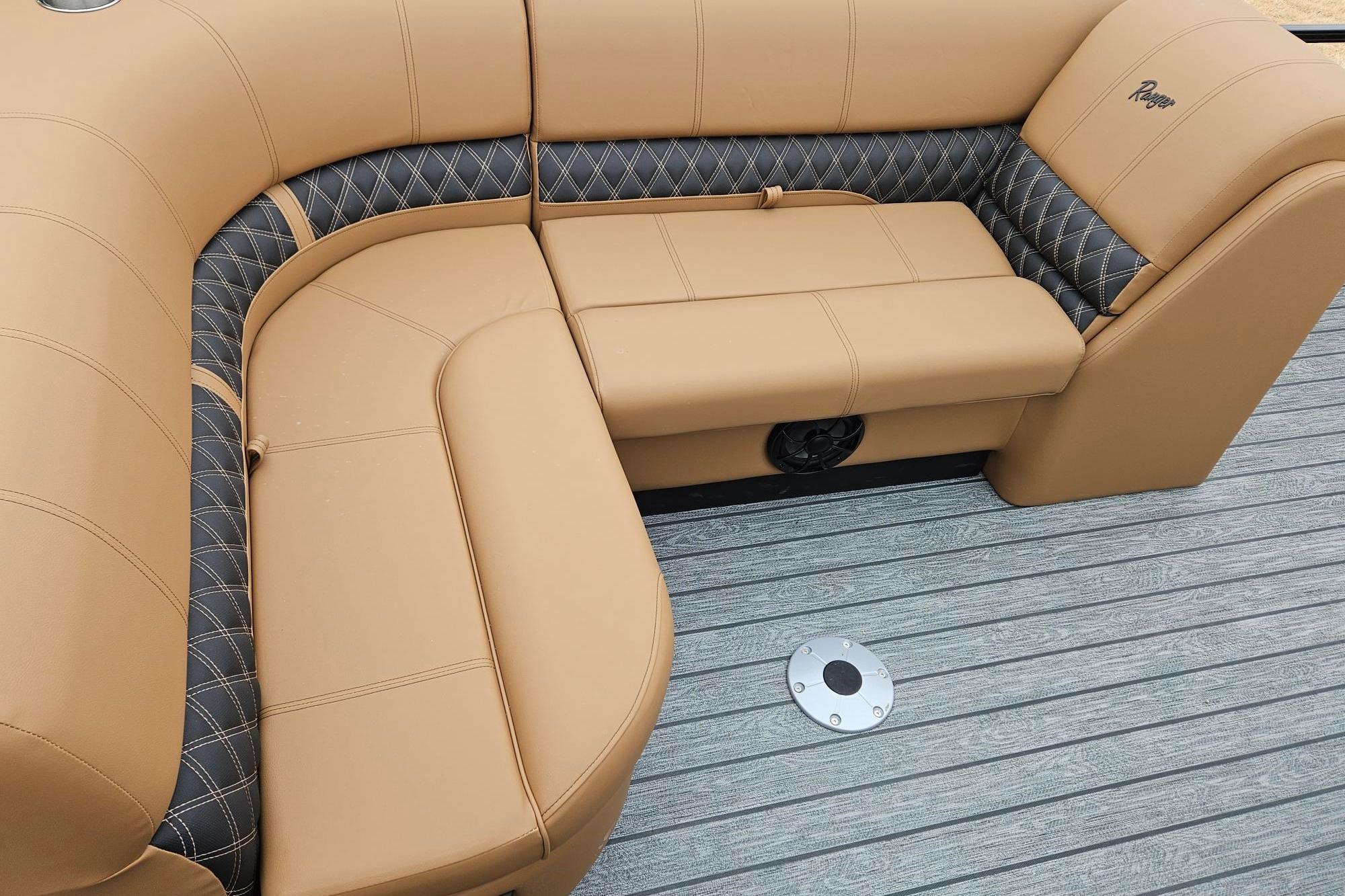 Luxurious tan seating on 2026 Ranger 220F boat with quilted accents.