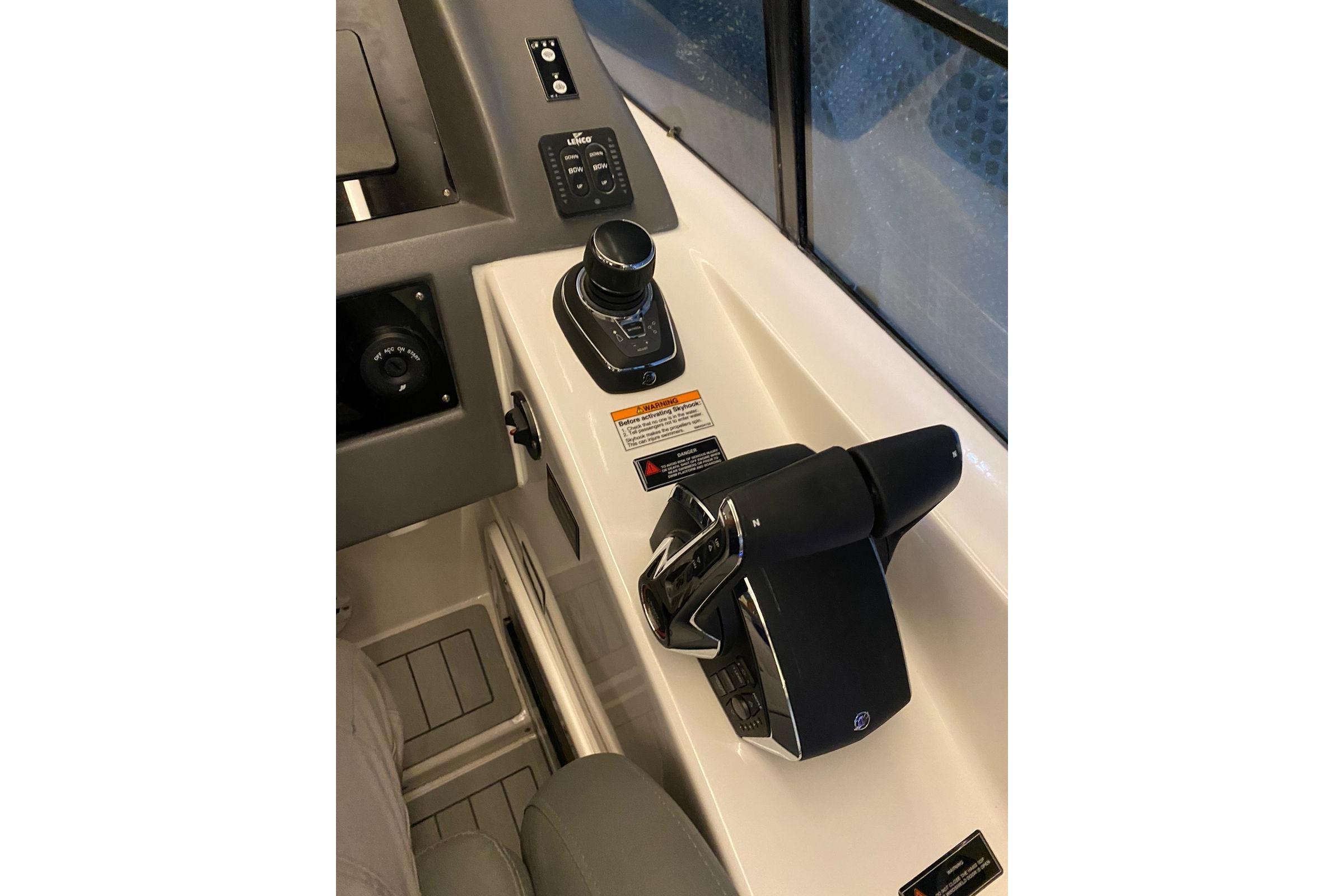 Control panel of 2026 Hanover 375 boat with joystick and throttle controls.