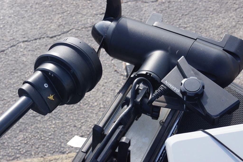 Close-up of a 2025 Phoenix 921 Elite boat motor with Garmin attachment.
