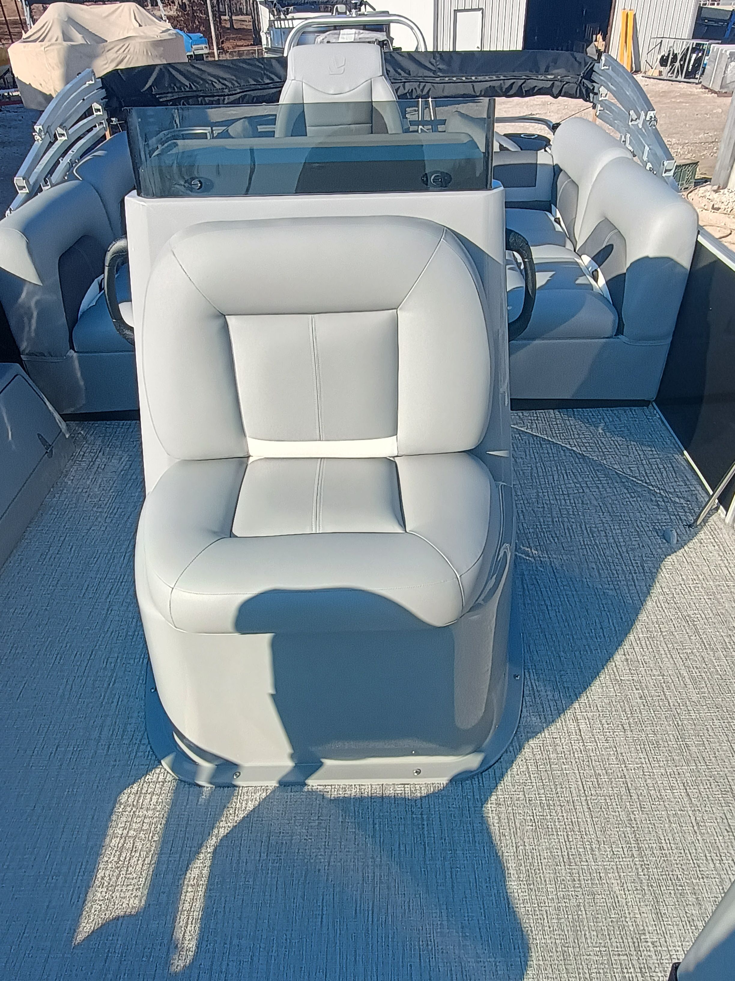 Interior of 2026 Landau Alure 25CC Fish-Black with gray leather seats.