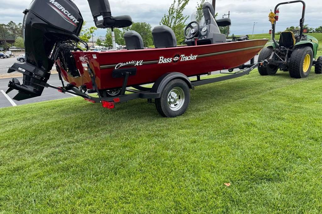 2026 Tracker Bass Tracker Classic XL boat on trailer, parked on grass.