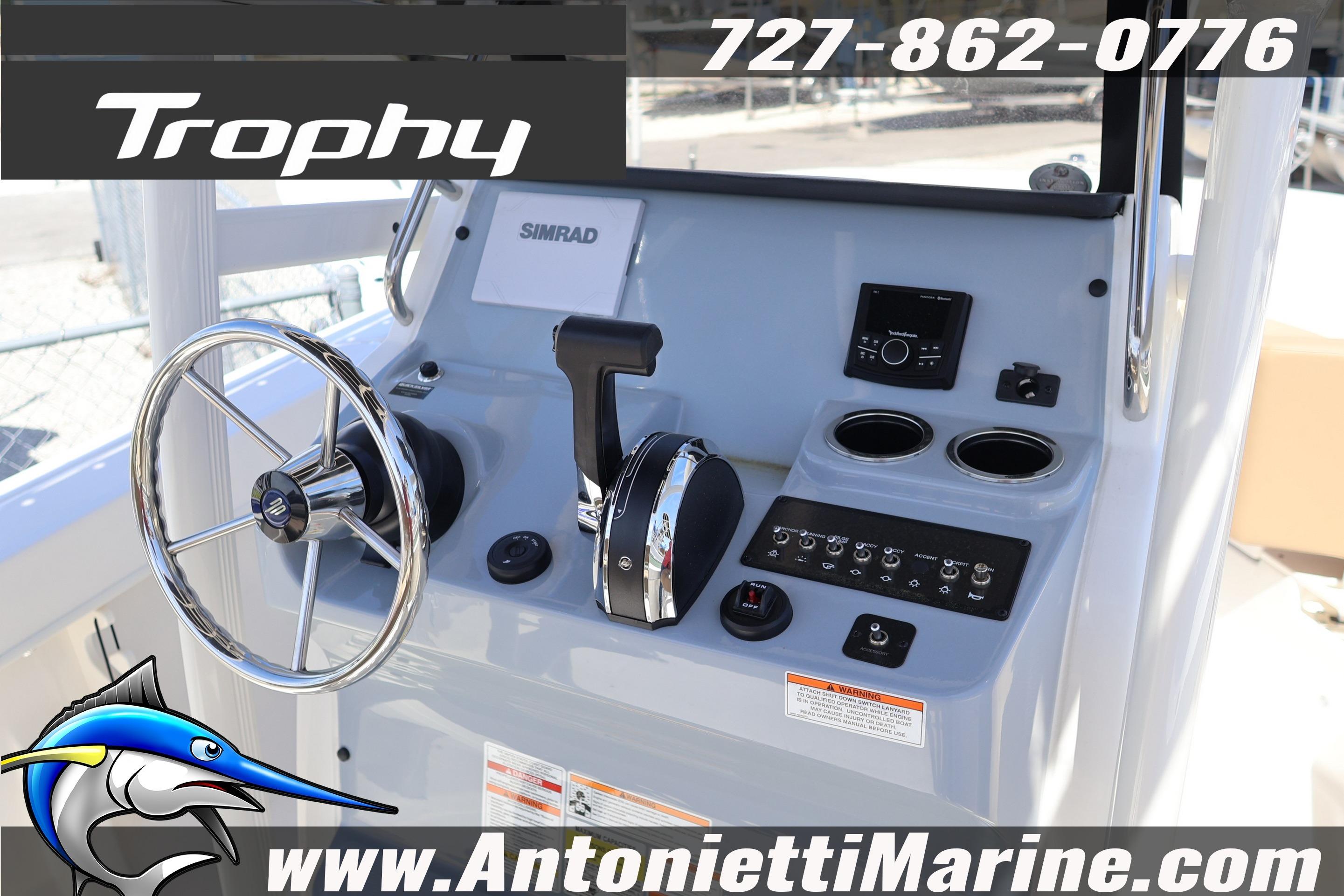 2026 Bayliner Trophy T20CC boat dashboard with steering wheel and controls.