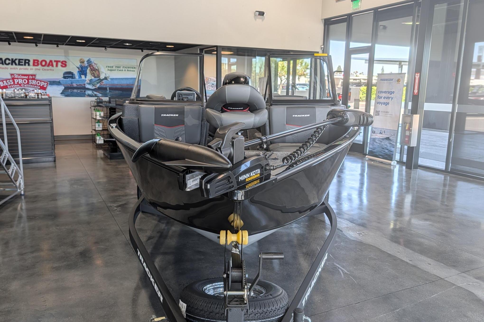 2026 Tracker Pro Guide V-175 Combo boat displayed indoors on a trailer.