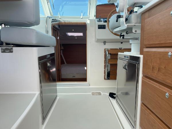2024 Back Cove 34O interior with modern amenities and wooden cabinetry.