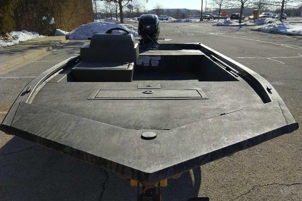 2026 Tracker Grizzly 1648 SC boat in a snowy parking lot.